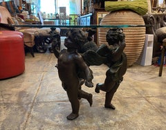 3 Cherubs Glass Top Coffee Table