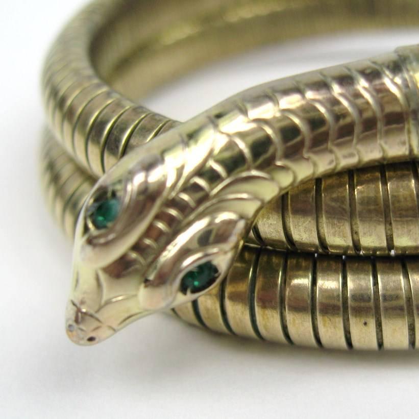 Green stones in eyes, 1940s 3 coiled snake bracelet. Wonderful green eyed snake! Hallmarked Amerikaner. This is out of a massive collection of Hopi, Zuni, Navajo, Southwestern, sterling silver, costume jewelry and fine jewelry from one collector. Be