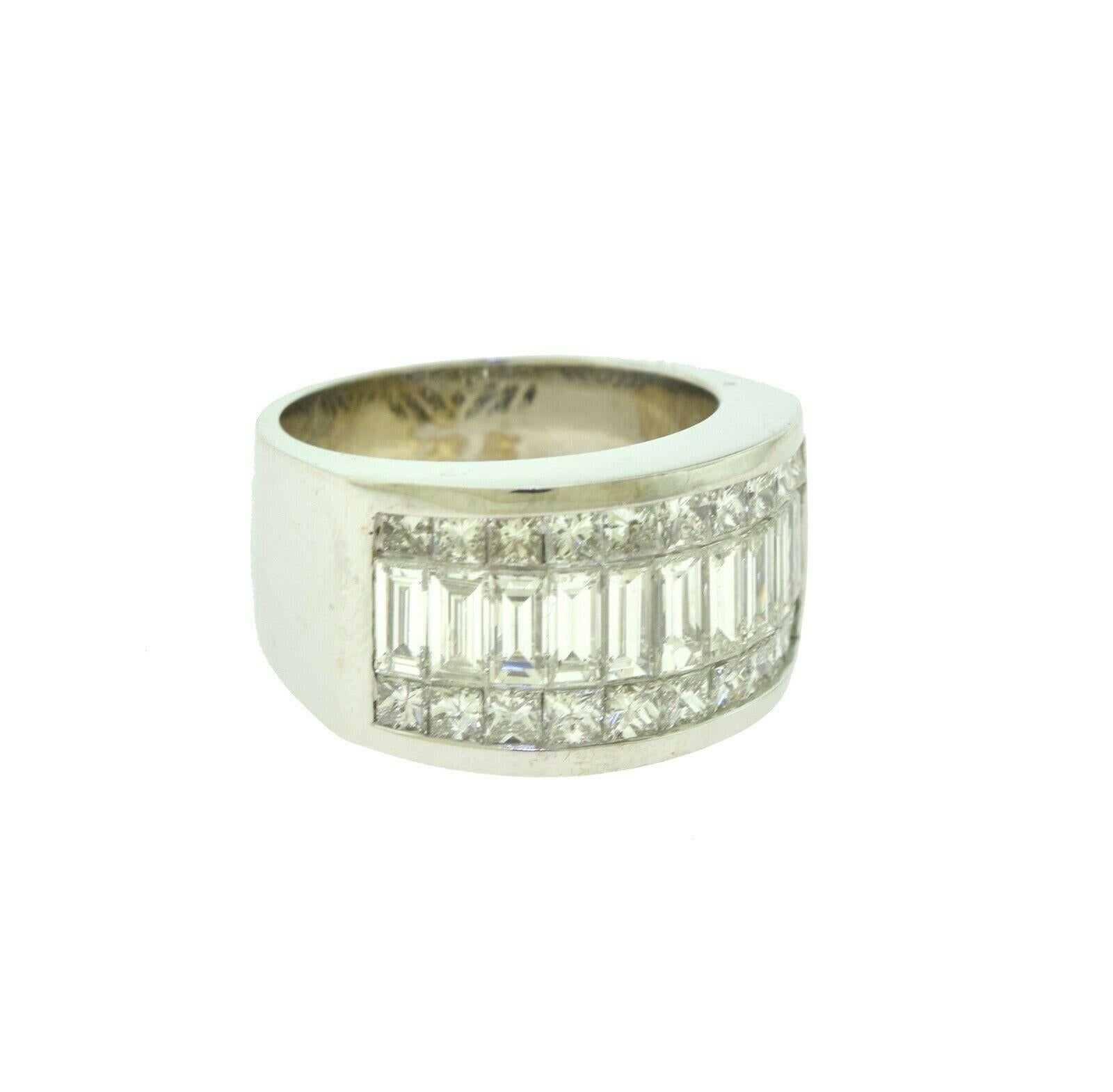 Style: Band

Material: White Gold

Metal Purity: 18K

Stones:   20 Princess Cut Diamond

10 Emerald Cut Diamonds

Ring Size:  6 ( Sizable)

Diamond Clarity: VS

Diamond Color: I

Total Item Weight (g): 14.6

Dimensions:  .9 x 1 inches

Ring