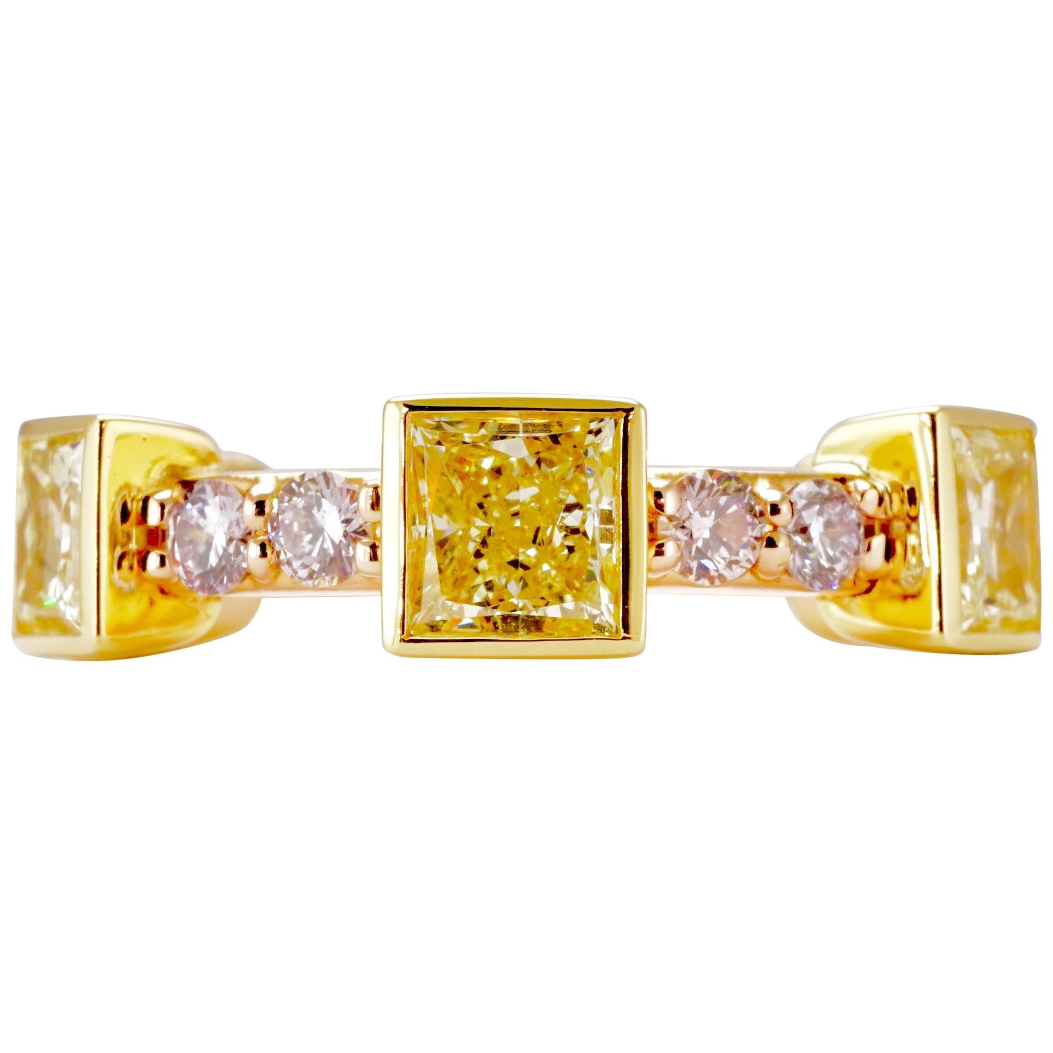 Alternating Natural Diamond Eternity band set in 18K Yellow gold and 18K Rose gold. Bezel set 6 Radiant Fancy Yellow cut Diamonds. Clarity - VS2-SI1. Carat weight: 2.10ct. 
12 Pave set Light Pink Brilliant Round diamonds. Clarity VS2-SI2. 
Carat