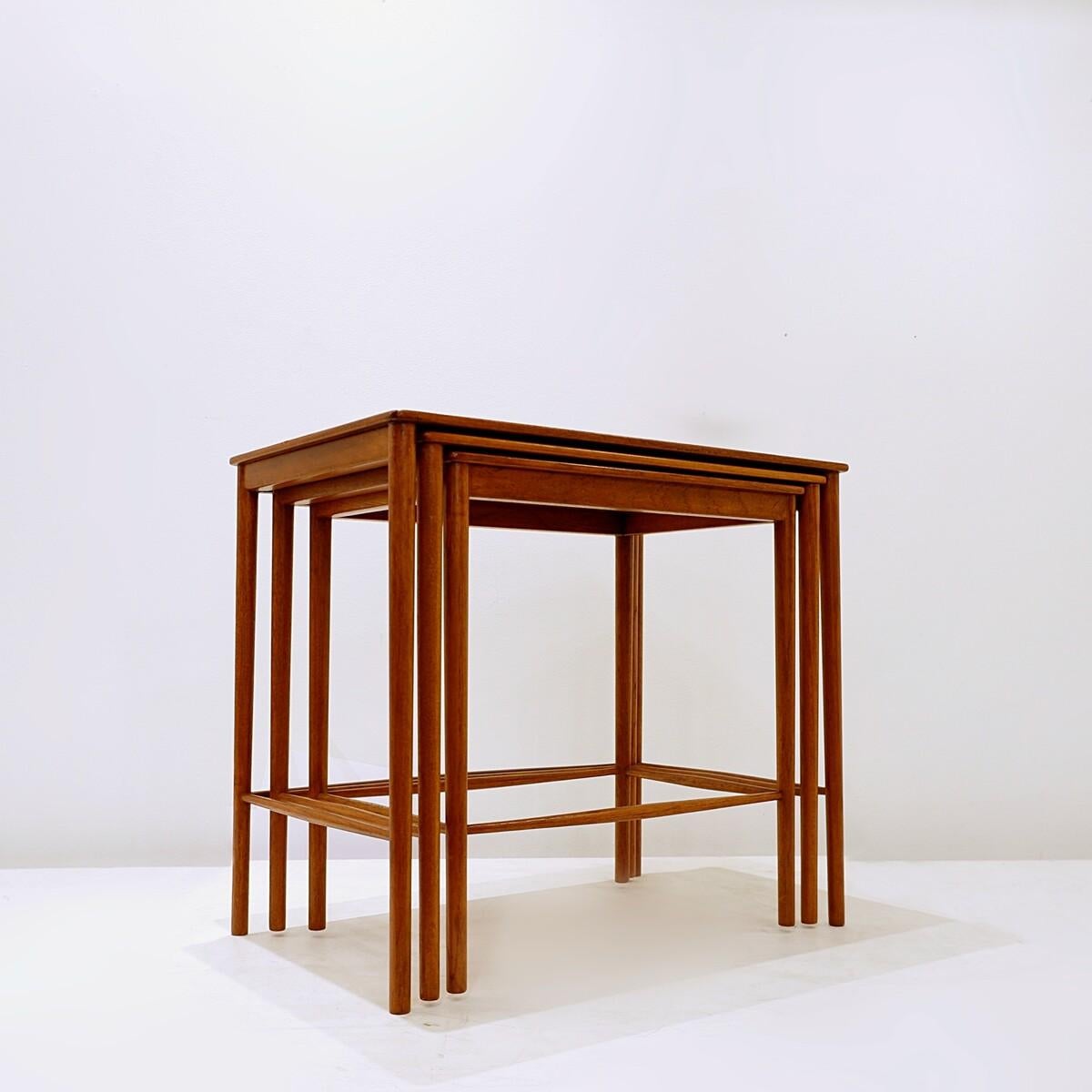 Very pratical Danish nesting tables with warm tones