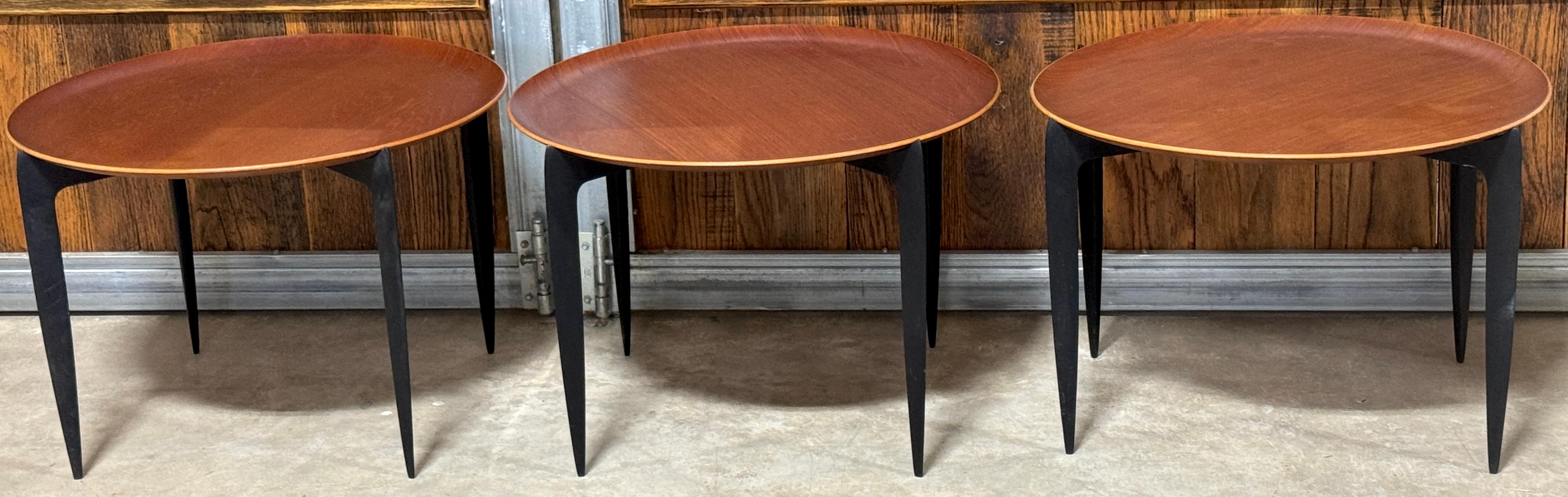 3 Danish Teak & Ebonized Circular Campaign Tray Tables by Fritz Hansen  Denmark, 1960s, Sold Individually 

This is a rare opportunity to acquire up to three iconic Danish Teak & Ebonized Circular Campaign Tray Tables by Fritz Hansen, Denmark,