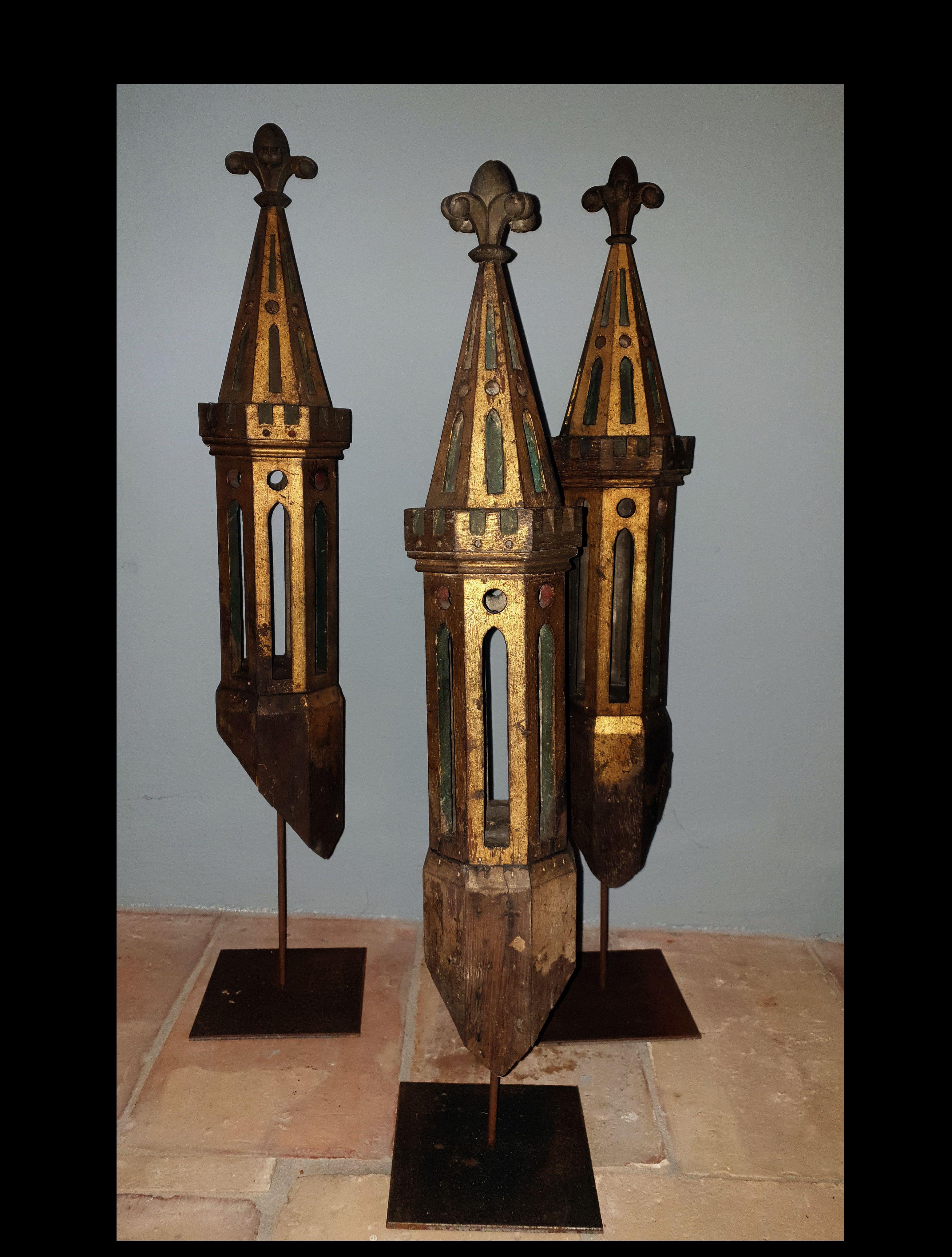 Set of three Gothic style church tower parts from a huge architectural model. Wood gilt. Each tower top on a ne fabricated stand, Germany, mid-19th century.
 