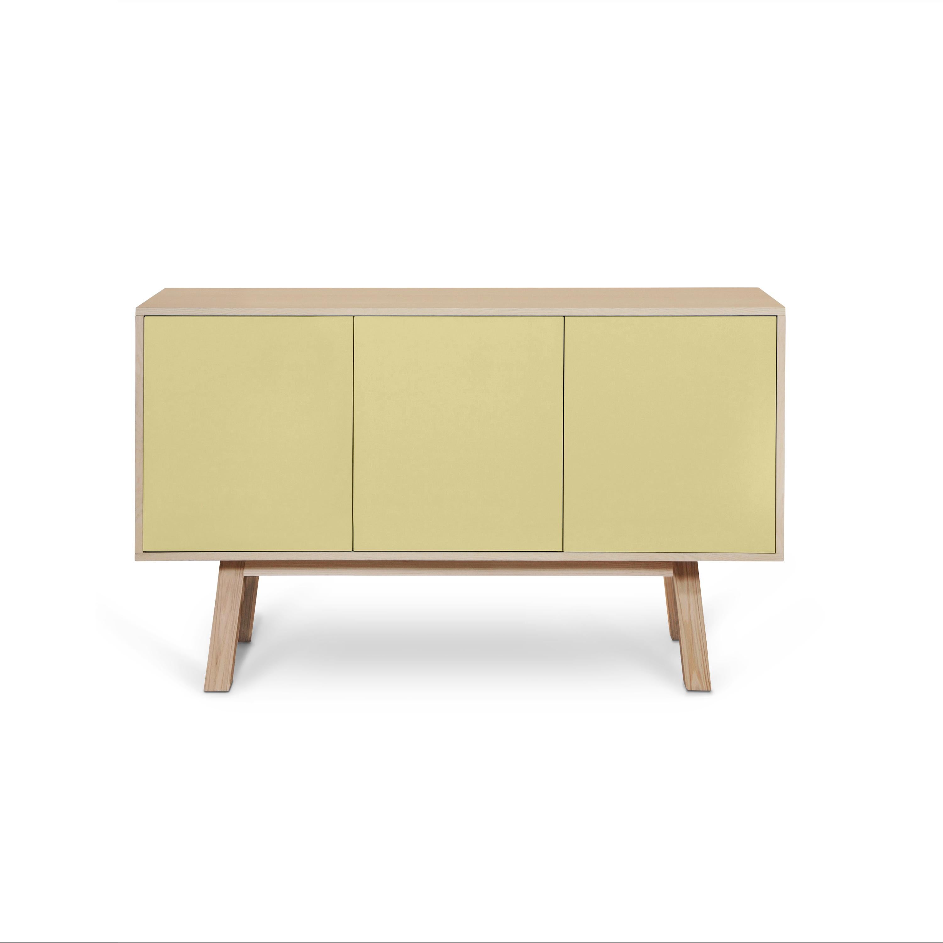 This 3-door sideboard is 100% made in France in oak, veneer oak and with lacquered doors in MDF panels. 

The 3 doors open with a 