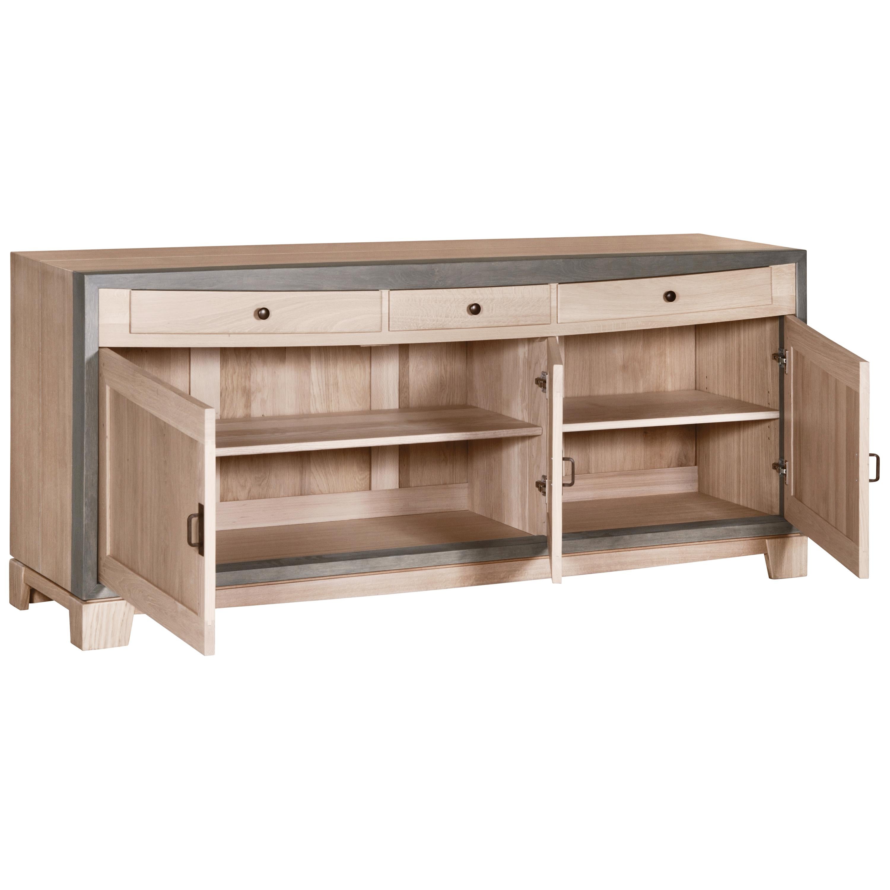 This 3-door sideboard belongs to the SIENNA collection and was created by the French designer Christophe Lecomte. Christophe uses oak, as a French noble wood to enforce the feeling of durability and timeless lines of this collection. The straight