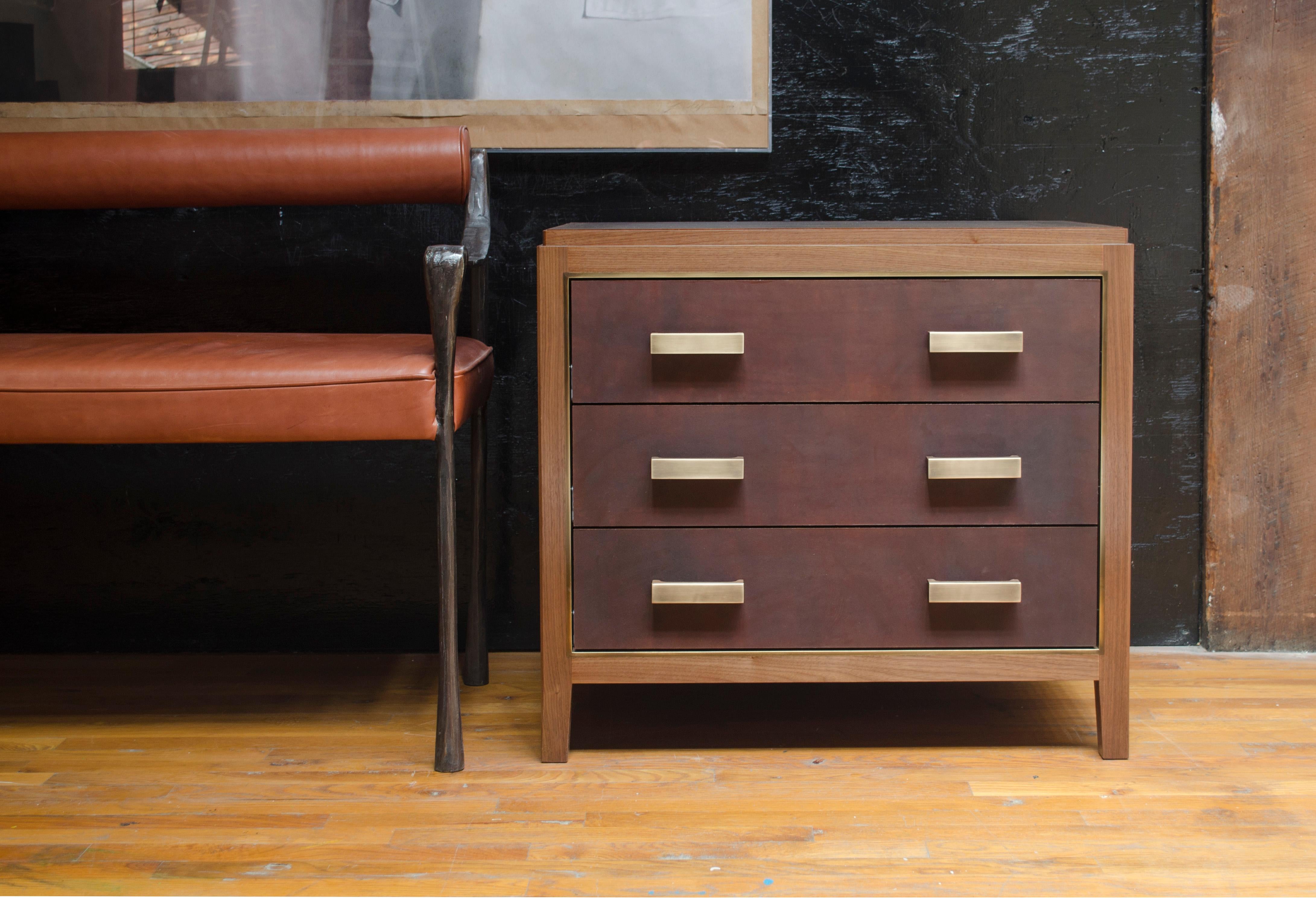 Solid walnut construction featured with three drawers. Wood options also include oak or wenge. Configuration options also include single or two drawers with open shelving. Brass trim and hand-dyed saddle leather drawer fronts and blotter. Leather