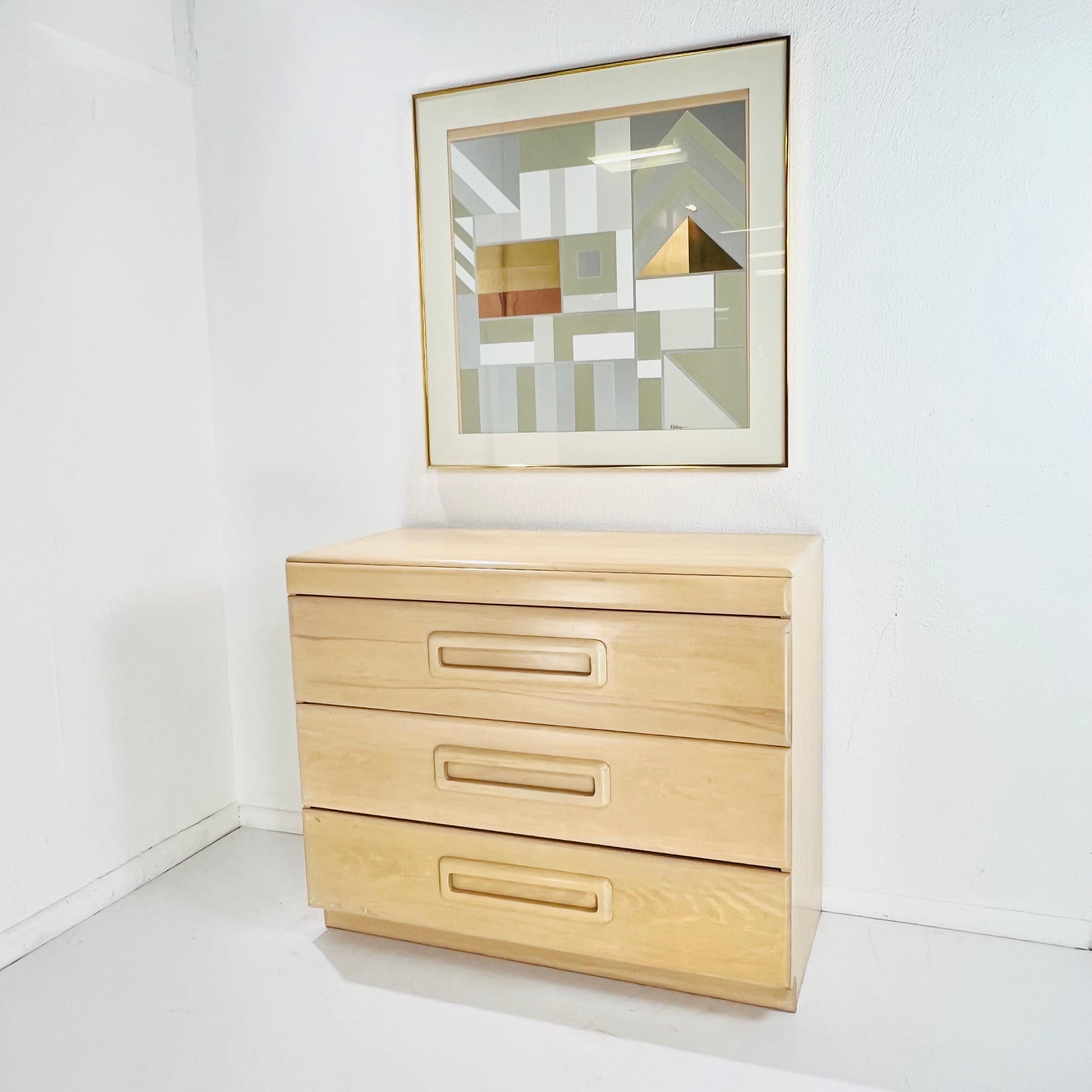 Iconic early 20th century American modernist blonde maple dresser featuring drawers with wooden pulls and dovetail joints, designed by Russel Wright for Conant Ball, circa 1940. Beginning in the late 1920s through the 1960s, Russel Wright created a