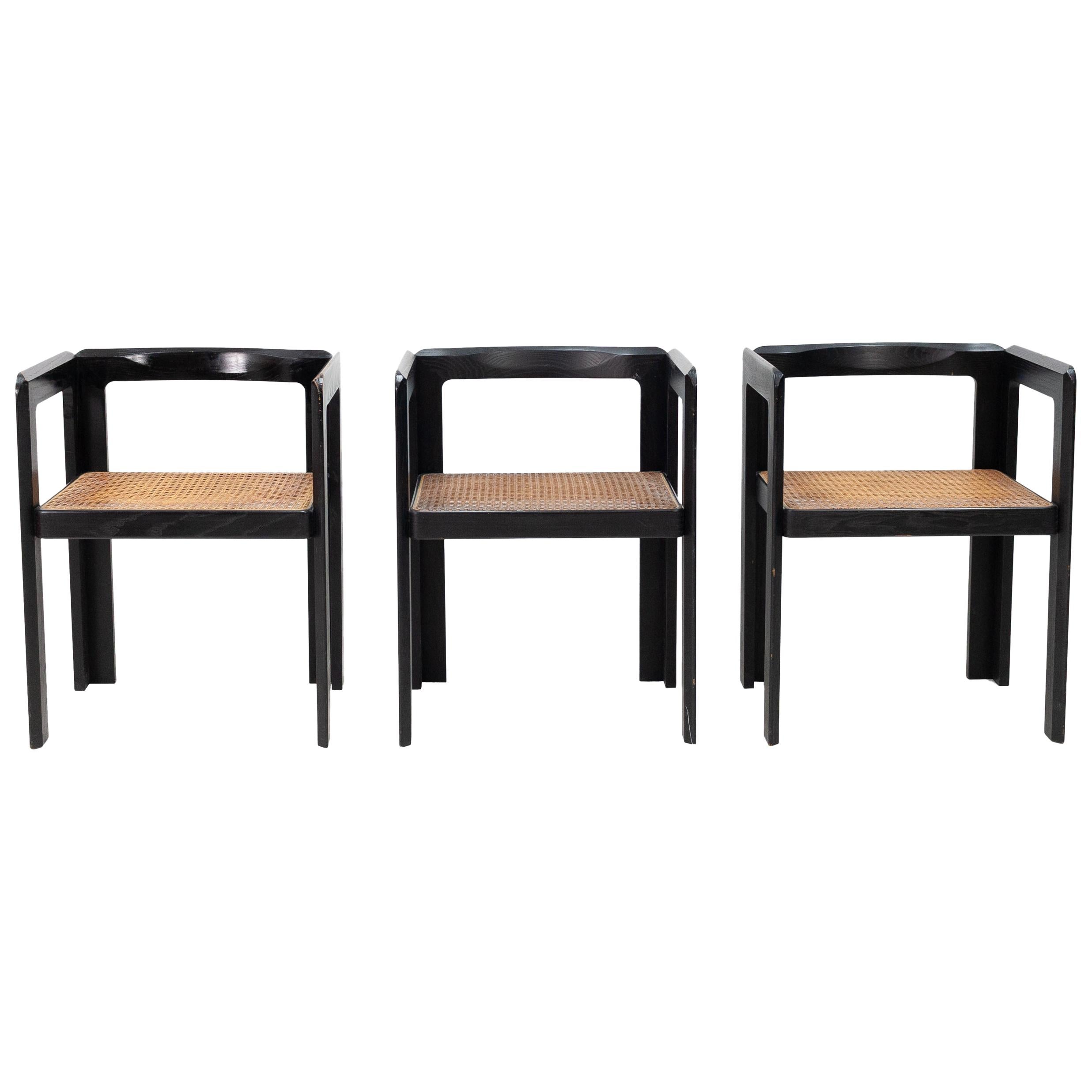 3 Ebonized Wood and Rattan Club Chairs