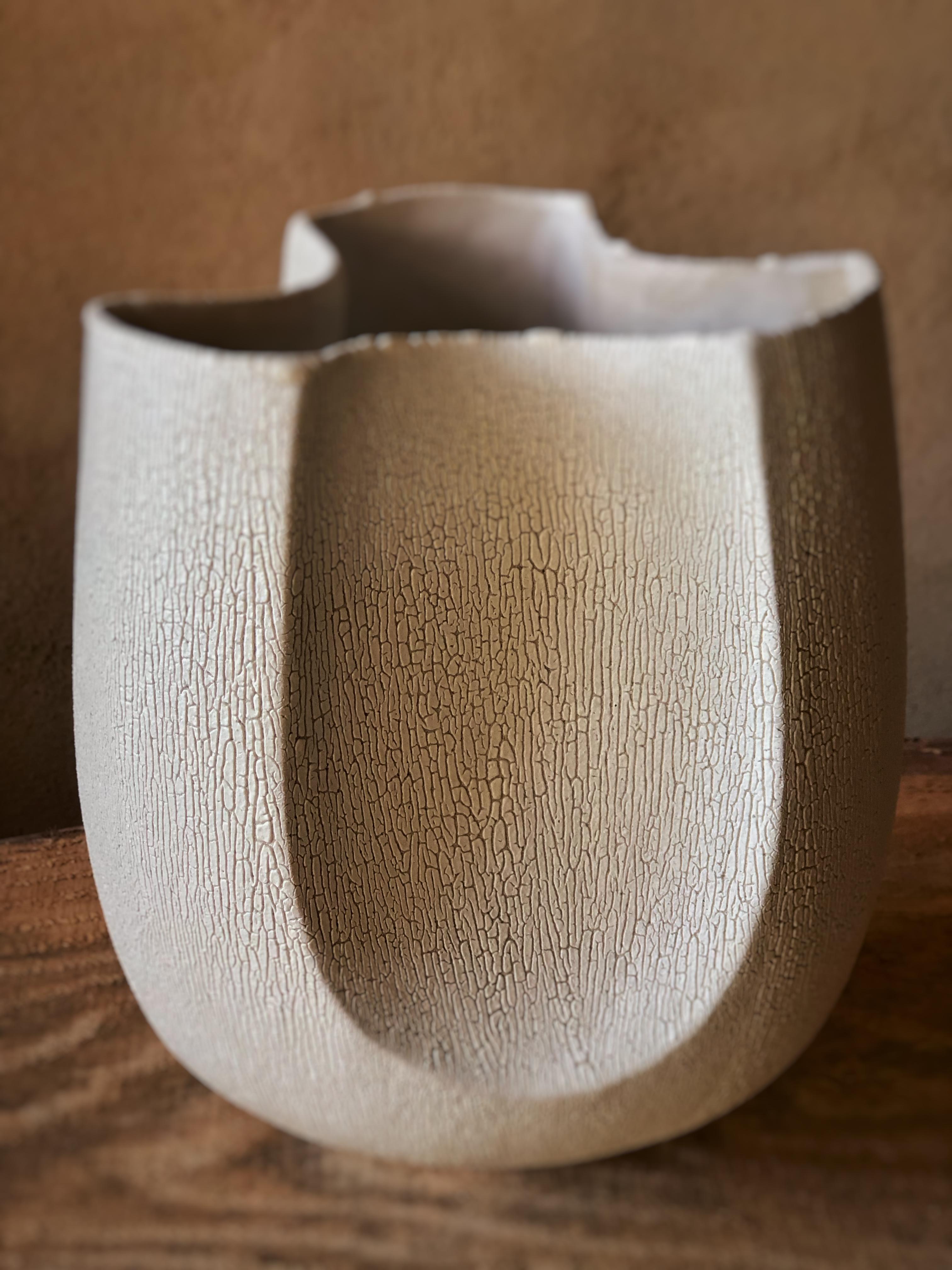 3 Facetted Vase With White Crackle Glaze by Sophie Vaidie
One Of A Kind.
Dimensions: Ø 18 x H 23 cm. 
Materials: Stoneware with white crackle glaze.

In the beginning, there was a need to make, with the hands, the touch, the senses. Then came the
