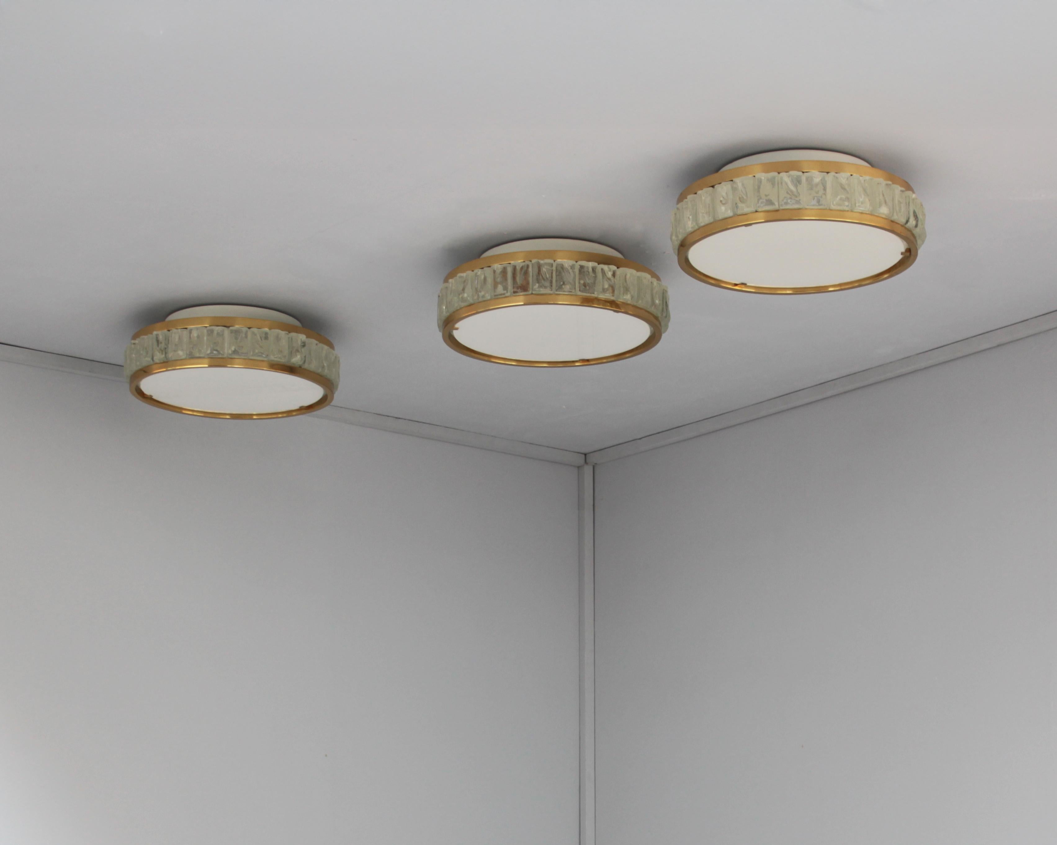 Atelier Perzel- Three fine French mid-century round “Queens Necklace” ceiling light made with rough laid glass slabs set between two brass frames and a white opaline glass diffuser (which is removable in order to replace the bulbs).

Price is per