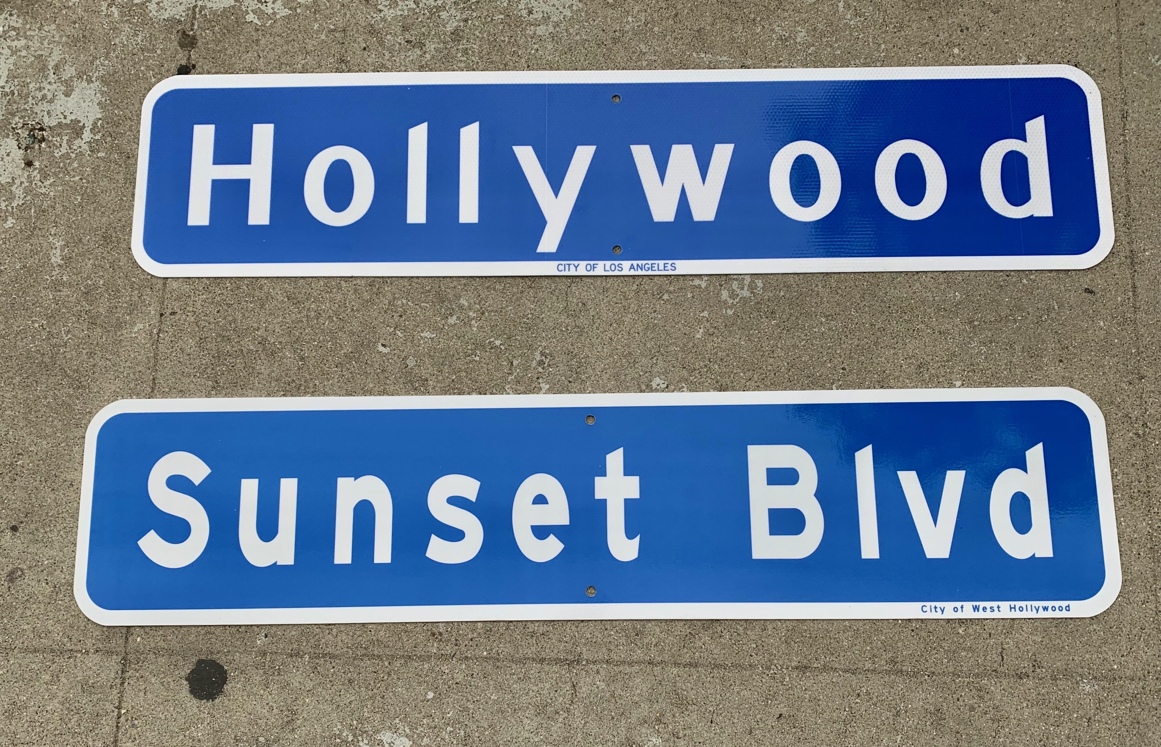 Very cool street sign from the city of Los Angeles. Sunset Blvd sign with white lettering on blue background. Extremely good condition. Marked City of West Hollywood on the front. Measures: 3 foot long.

 