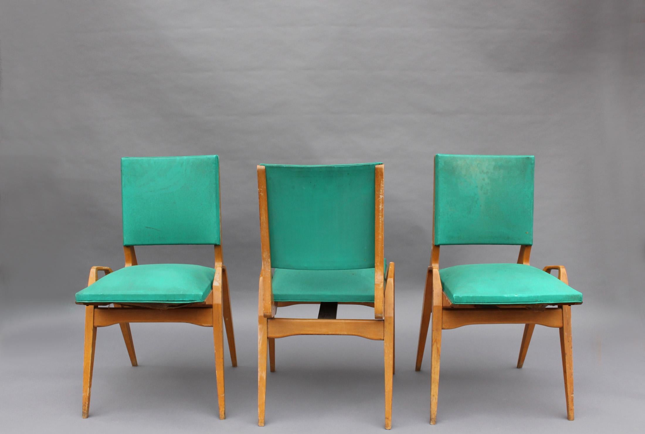 Three French 1950s solid beech chairs by Ségalot.
Documented.
  