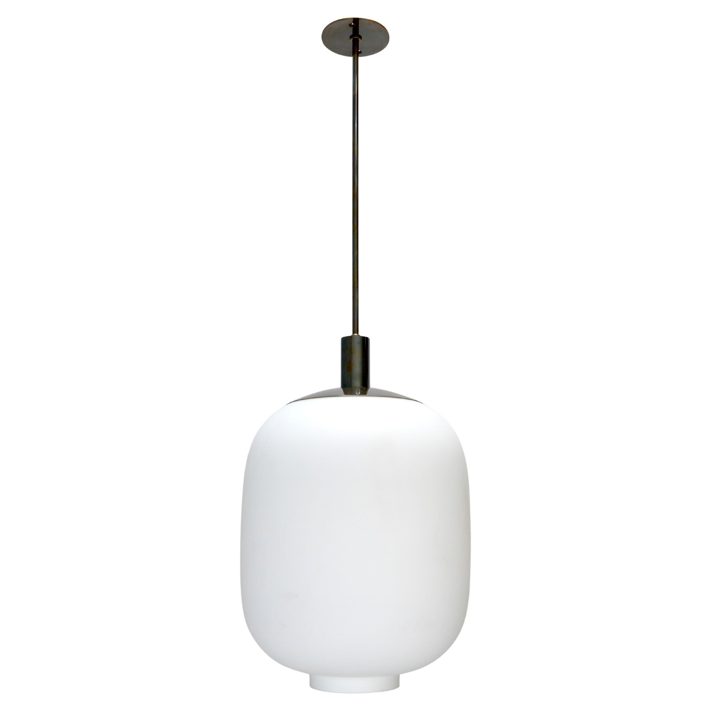 3 Stunning glass and brass pendants in the manner of Stilnovo from the 21st century. Dark patinated brass finish and blown glass, wired with 1-E26 medium based socket for use in the US. Light bulb included with order. Priced individually.