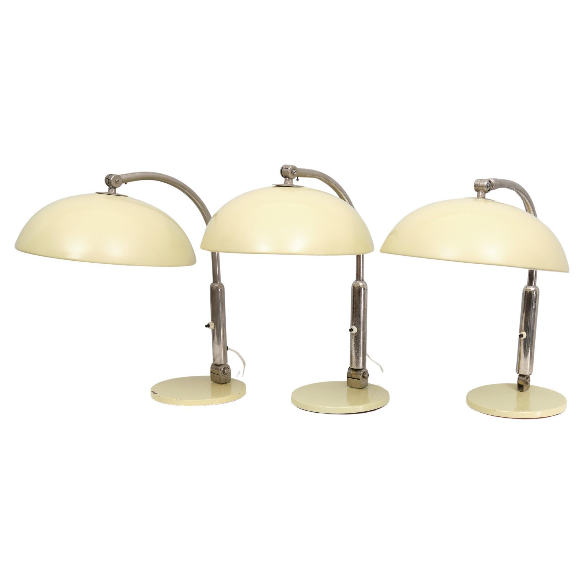 Unique set of Three identical Desk lamps .Manufactured by Hala Zeist 
Design by Herman Theodoor Jan Anthoin Busquet  from the 1950s 
These examples are from the 1970s .in a Mint Green color ,probable 
bin used in a office environment . because they