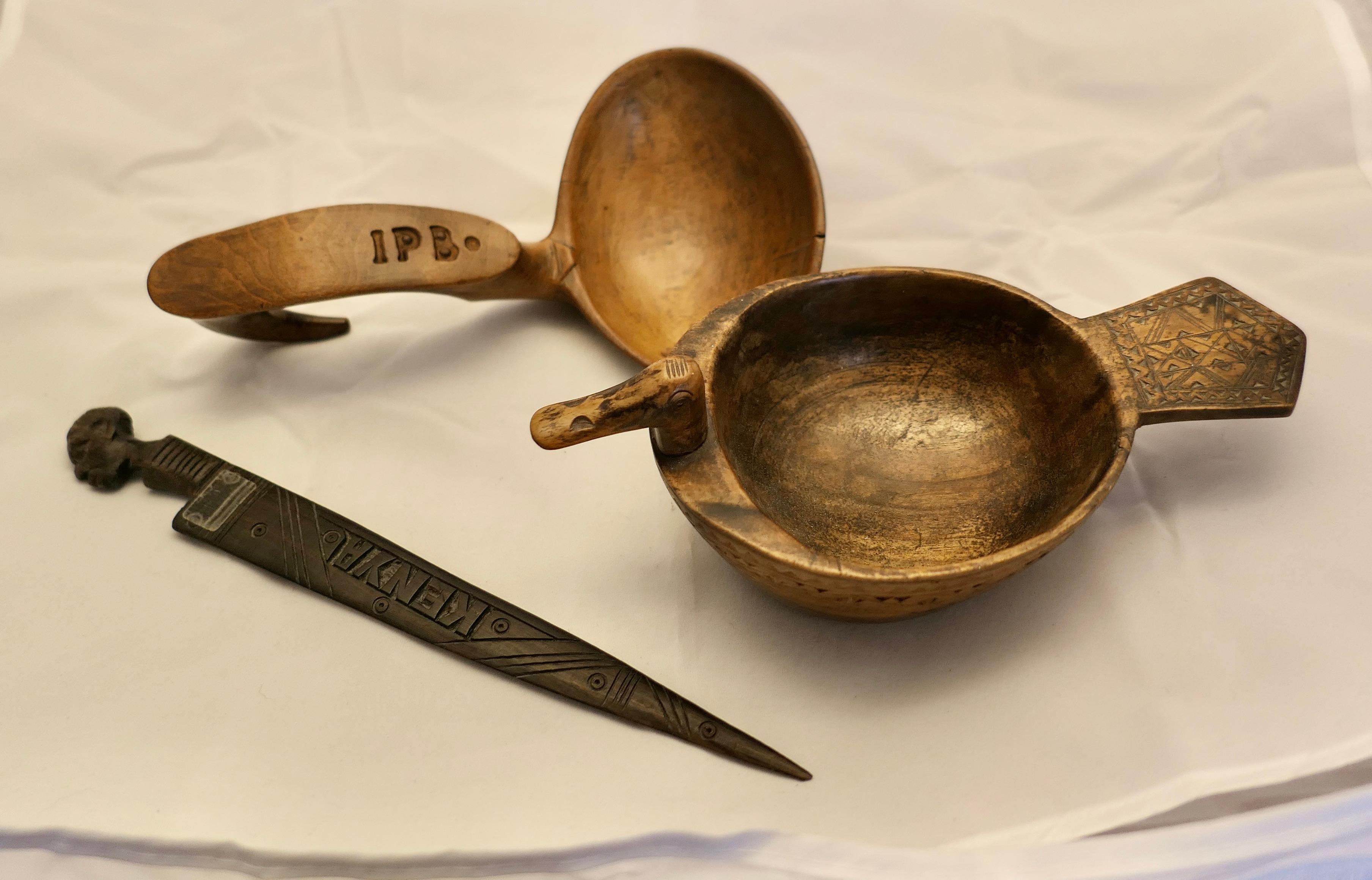 3 Hand Made Folk Art Treen Items

A Bowl in fruit wood carved with a duck’s Head and Tail
A carved Letter opener from Kenya 
And a Carved scoop with IPB. Carved in the handle  
The scoop is 8” long, and 4.5” x 4.5”
SC84
