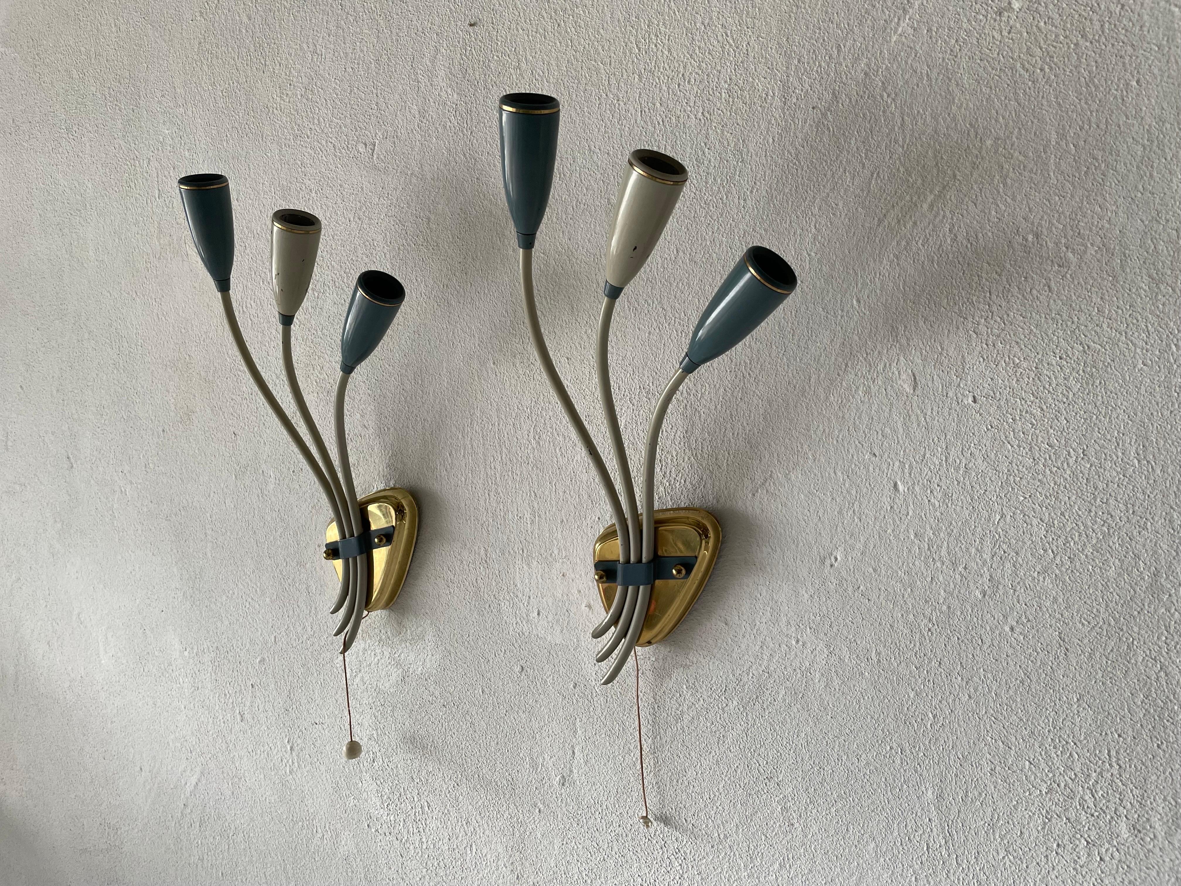 3-head Blue and White Metal Pair of Sputnik Sconces, 1950s, Germany

Very elegant and Minimalist wall lamps
Lamp is in very good condition.

These lamps works with 3x E14 standard light bulbs. 
Wired and suitable to use in all countries. (110-220
