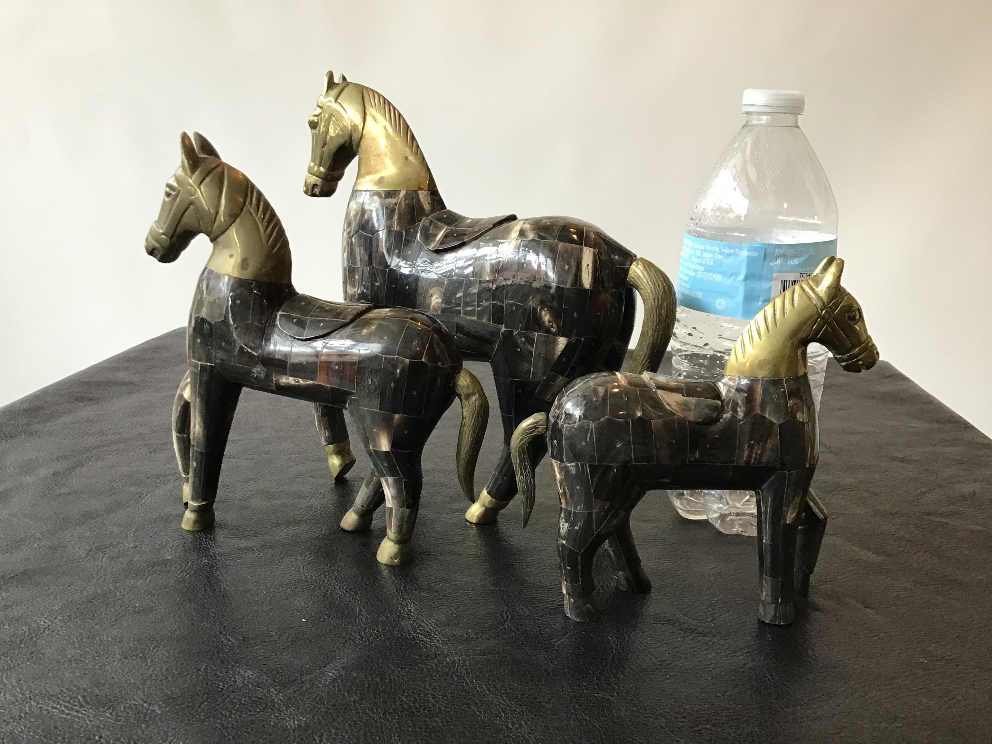 3 horn and brass horses. Made from small pieces of horn.
200 for the large horse.
175 for the medium horse.
125 for the small horse