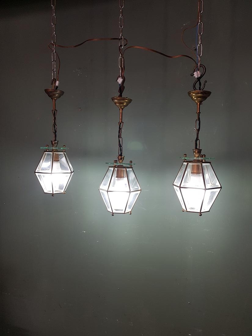 Set of 3 identical old French brass frame pendants with facet cut glass and they have a bayonet fitting, all 3 are in good condition with light wear consistent by age, and the electricity has been replaced by us. Originating from the mid of the 20th