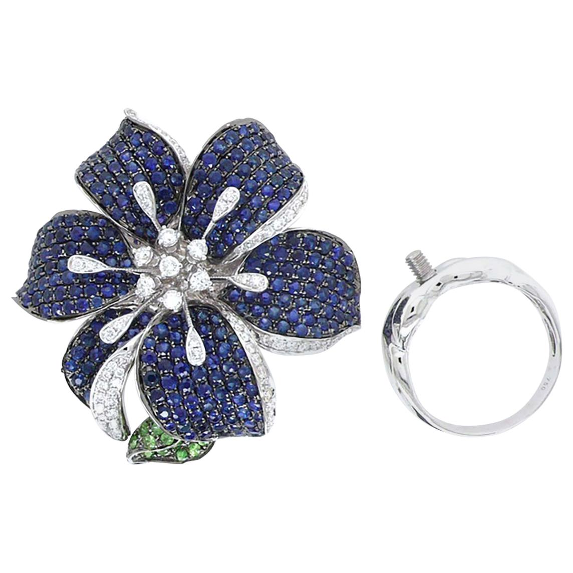 3 in 1 Blue Sapphire and Green Garnet Cocktail Ring, Brooch, Pendant

VERY FINE AND SPECIAL EXQUISITE PIECE! 

286 ROUND BLUE SAPPHIRES -  6.98 CT
81 ROUND DIAMONDS -  0.85 CT
28 ROUND GREEN GARNET -  0.54 CT
18K WHITE GOLD -  21.69 GM 
