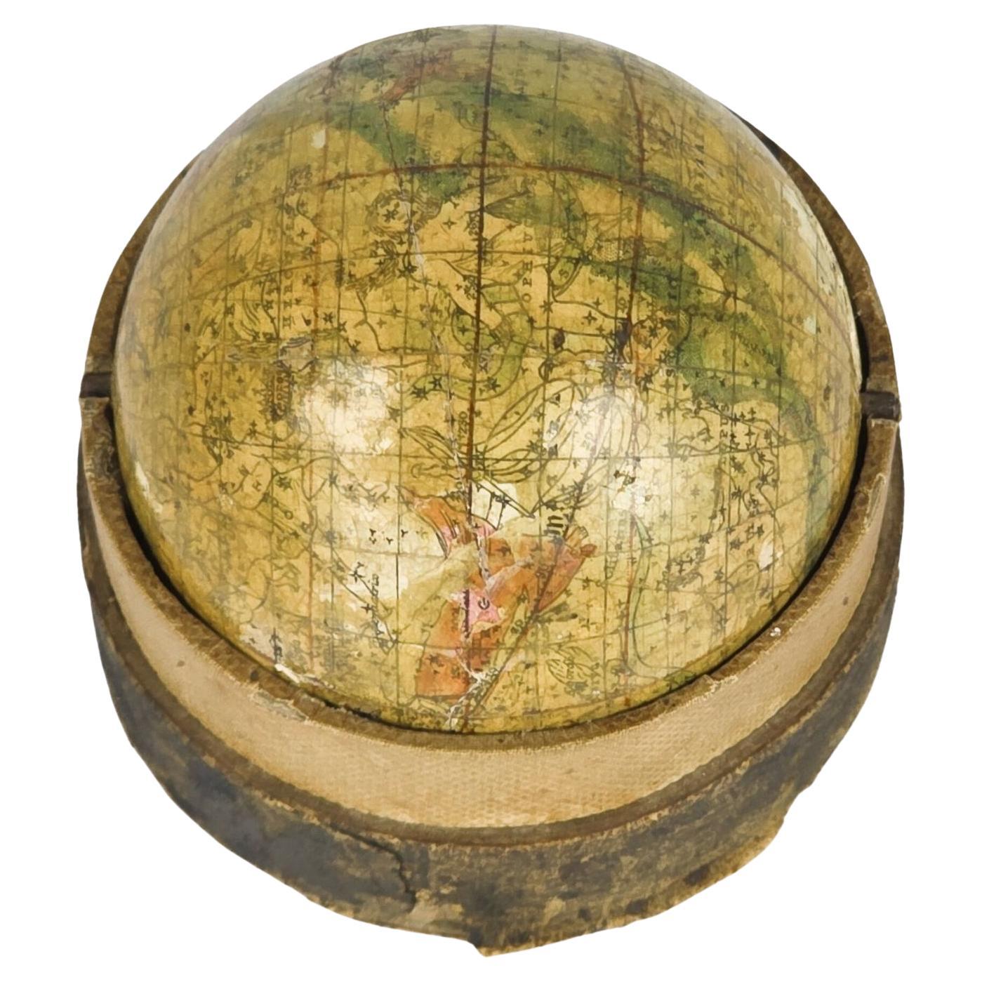 A terrestrial globe made up of twelve hand-coloured engraved gores, the equatorial graduated in degrees, the ecliptic graduated in days of the houses of the Zodiac, the continents delicately shaded and strongly outlined in green, showing nation