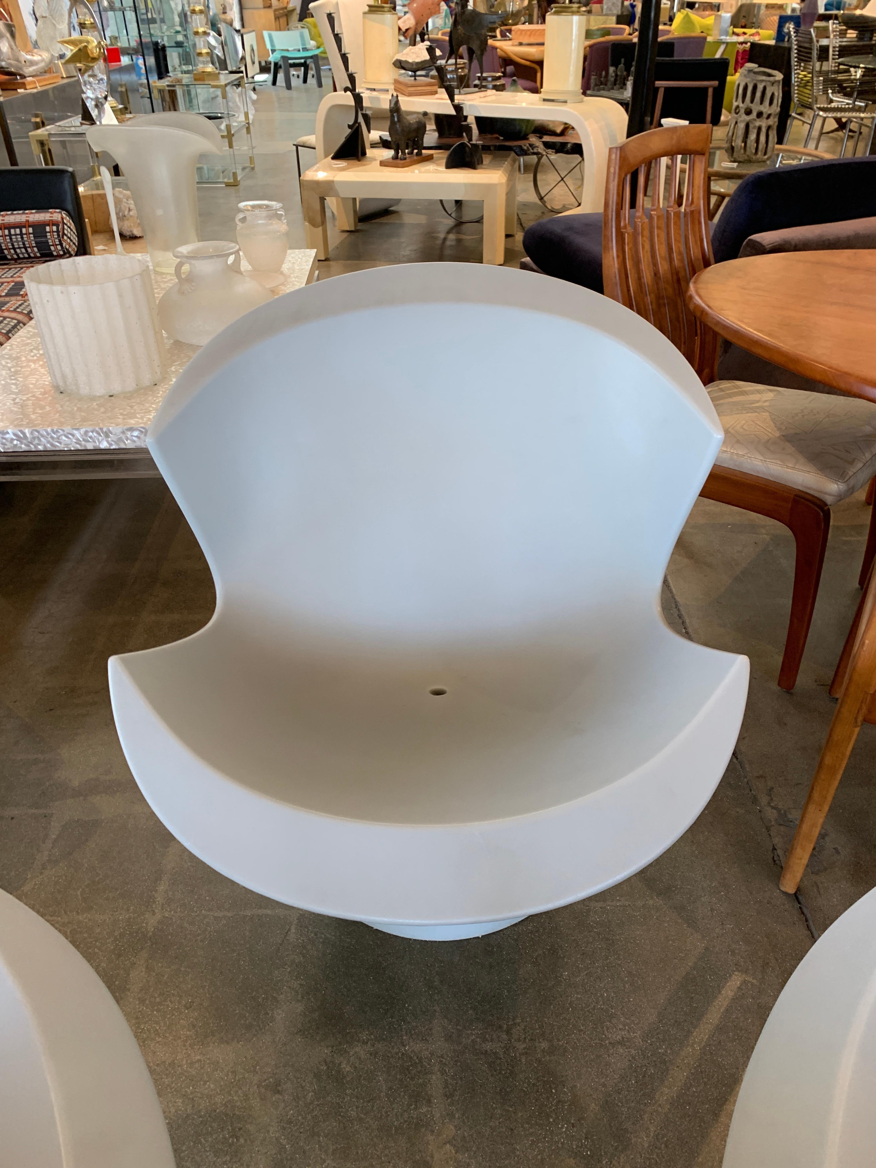 A set of 3 hard to find Karim Rashid designed chairs for Label from 2004. These are grey in color and are each stamped on the base. These all feature drainage holes so they may left outside. They are weather resistant and the color does not fade.