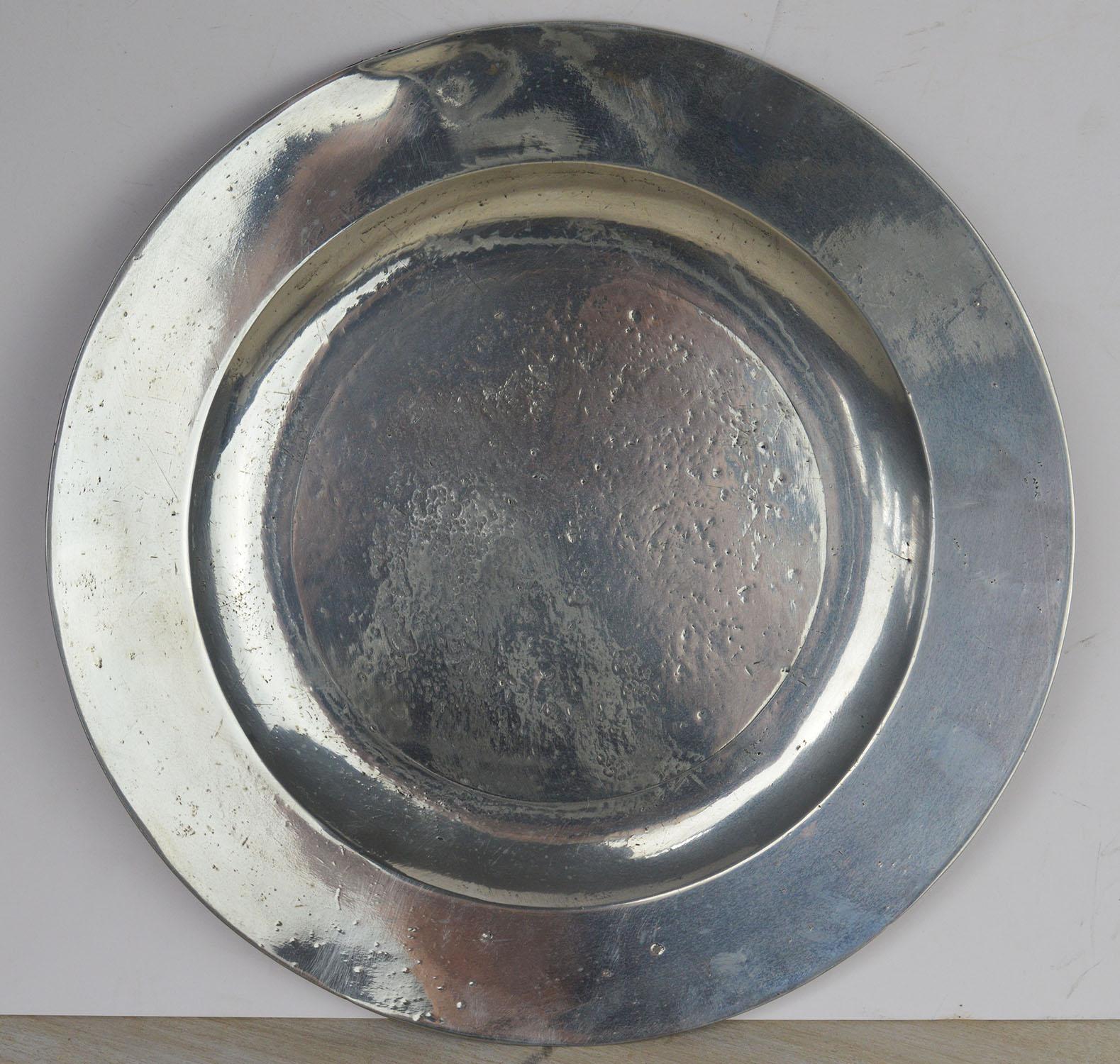 Wonderful highly polished chargers. A lovely distressed Industrial look.

Traces of the makers marks on the undersides

The pewter has been polished to its original shine. It was known as the Poor Man's Silver.

The great thing about polished