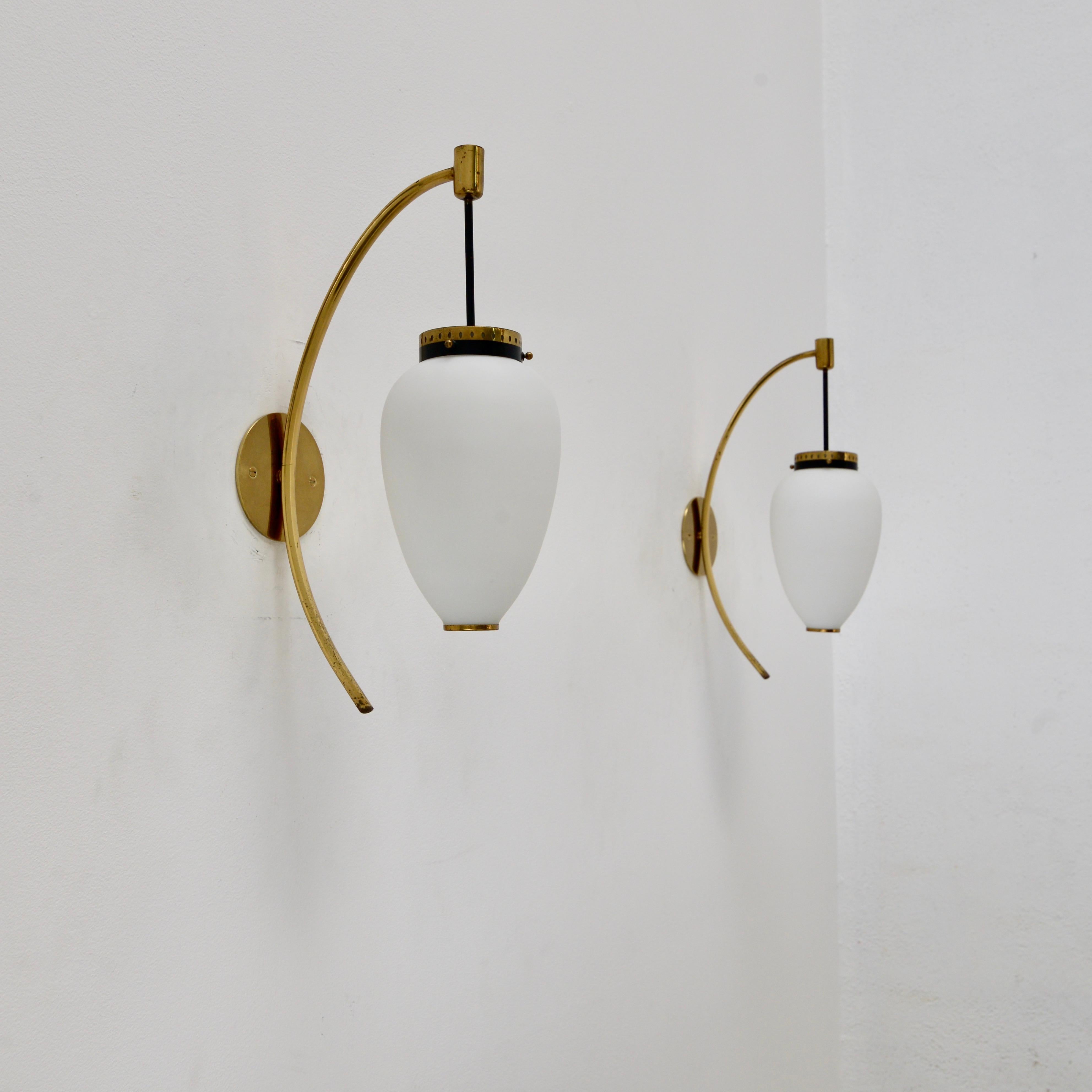 Classical 1950s pair of Large Stilnovo Sconces from Italy. These sconces are naturally aged and partially restored and rewired for use in the US with a single E12 candelabra based socket per sconce. Priced individually. Lightbulbs included with