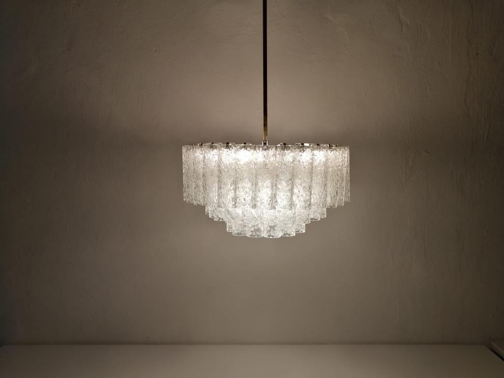 3 layer multiple glass tubes chandelier by Doria Leuchten, 1960s Germany

Mid-Century Modern spectacular pendant lamp.
Lamp is in good condition. 

Individually hand blown textured ice glass tubes.

Glass Tubes hang on metal hangers on the