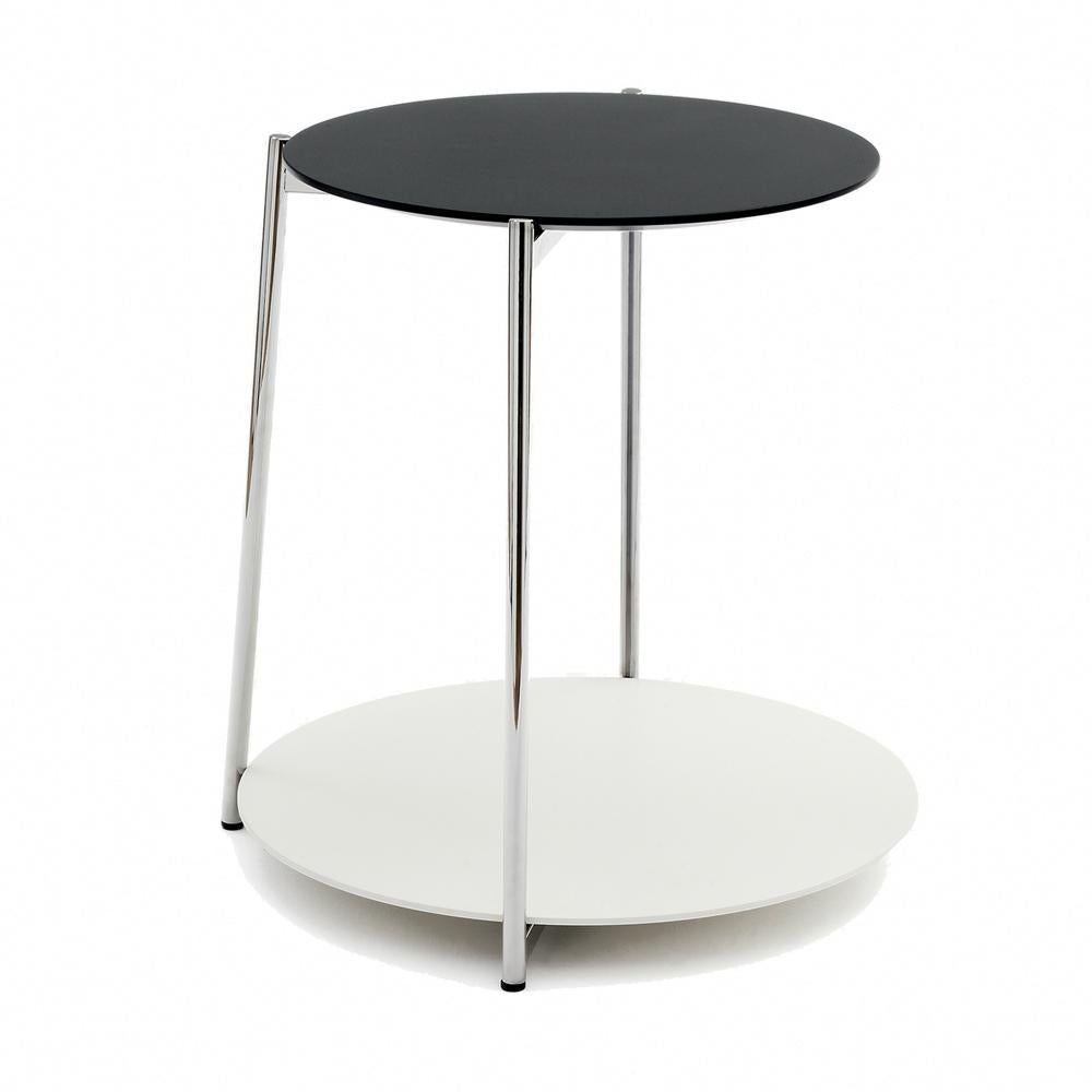 3 leg Shika side table by A+A Cooren
Materials: Base in chromed or black lacquered metal. Upper top in dark green, gray, or beige lacquered MDF Lower top in white lacquered MDF
Dimensions: Diameter 40 cm / 48 cm x Height 52 cm
Also available