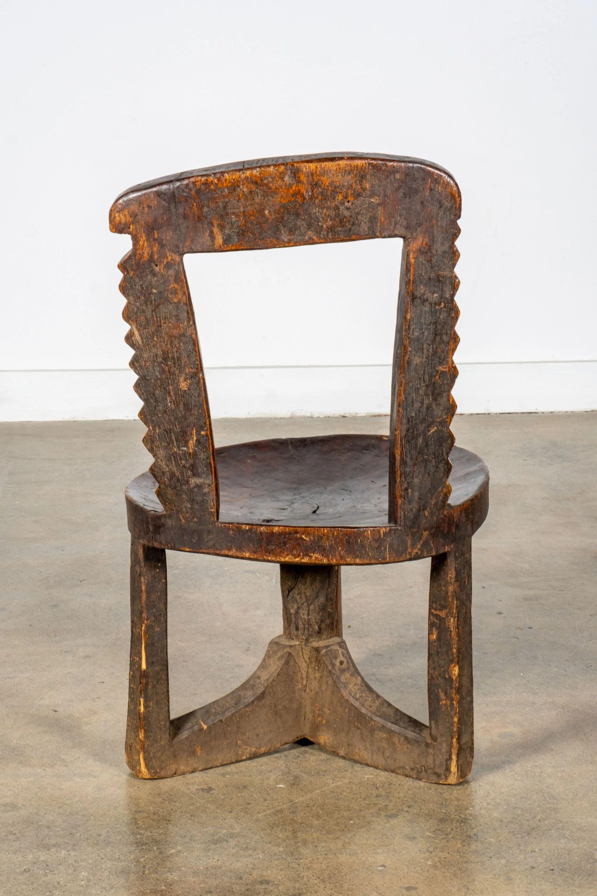 Brutalist 3-legged African Wood Chair with Scalloped Back