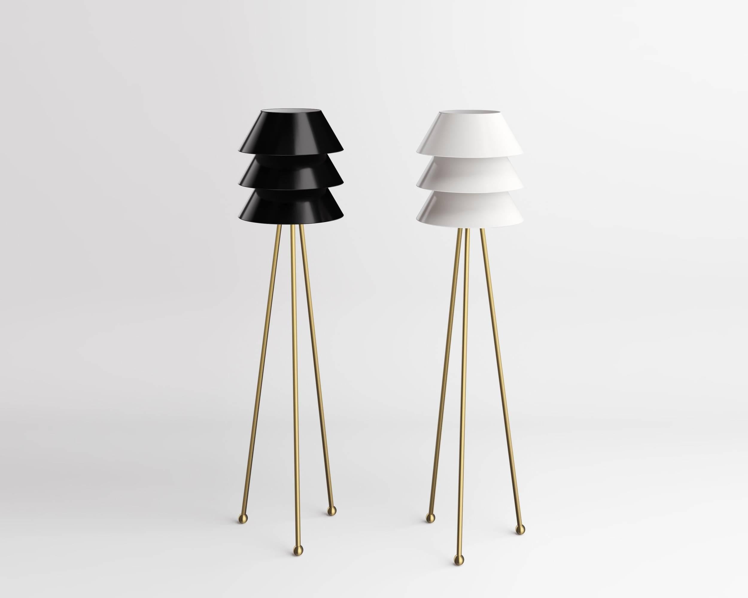 Floor lamp by Russian designer Dmitry Samygin

Brass tripod base, aluminium lampshade (black, white, red, green or yellow). 
Measures: 163 cm x 40 cm x 40 cm

After studying Applied Arts at the National University of Art and Industry,