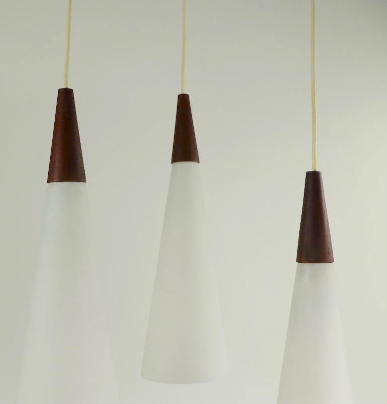 Scandinavian Modern 3-Light Cone Glass and Teak Pendant Chandelier Attributed to Holmegaard