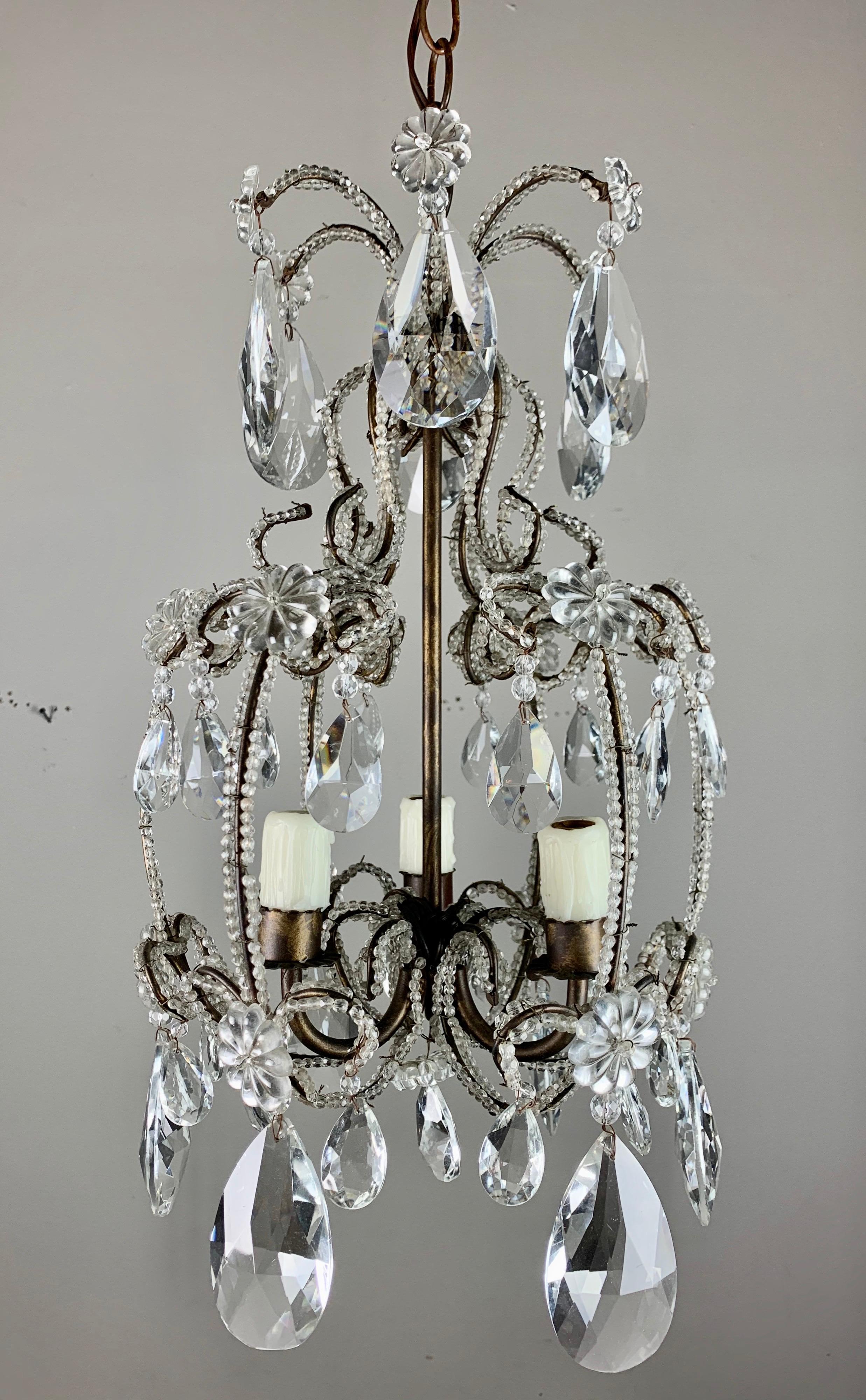 Italian 3-light crystal beaded arm chandelier with beautiful faceted almond shaped crystals. Newly rewired and includes chain and canopy.