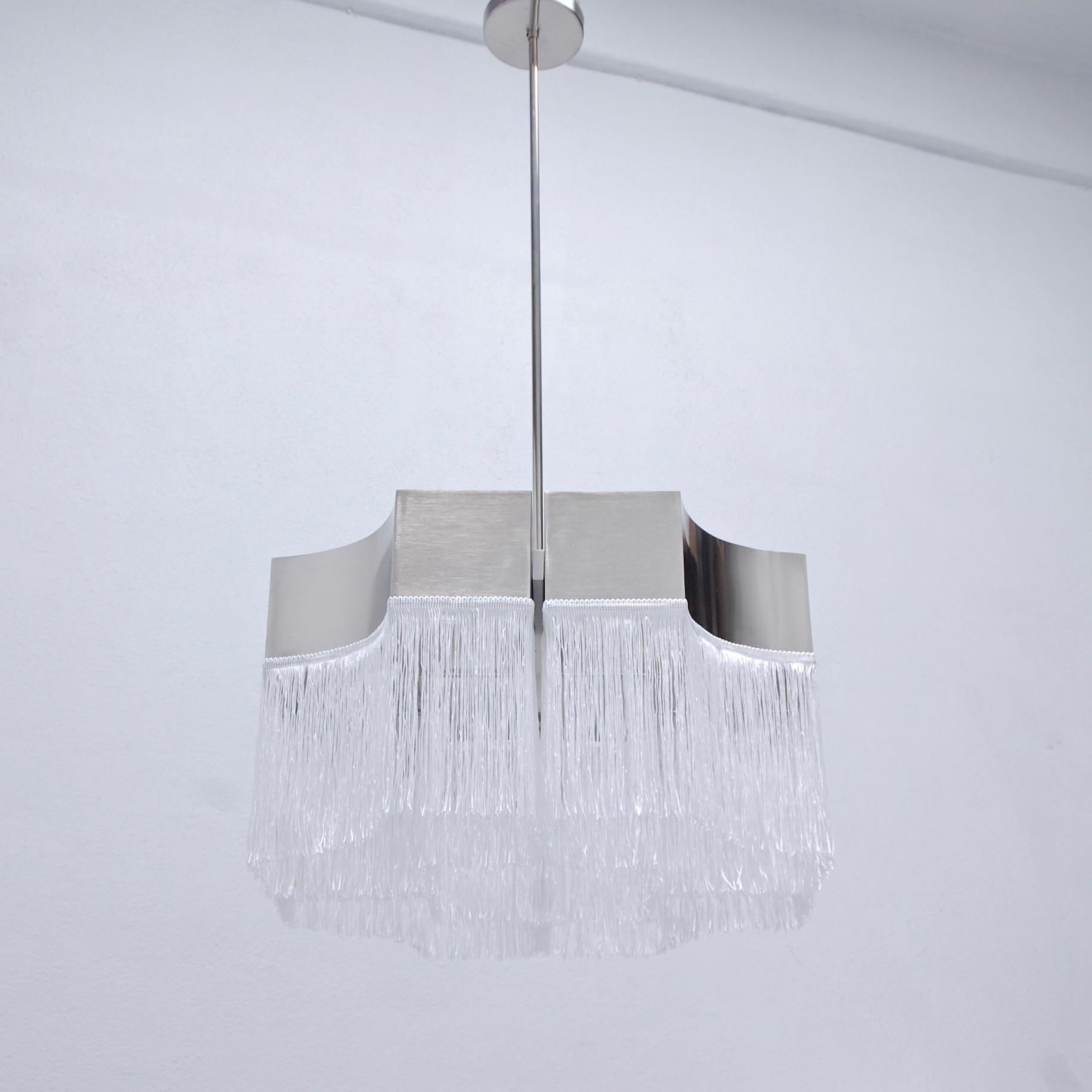 2 stunning 1960s chandelier attributed to Massimo Vignelli from Italy in nickel-plated steel and white fringe. With eight candelabra based E12 sockets. Max wattage per socket 25 watts rendering 200 watts total illumination. Currently rewired for use