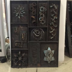 Three Metal Wall Plaques in Style on Evans