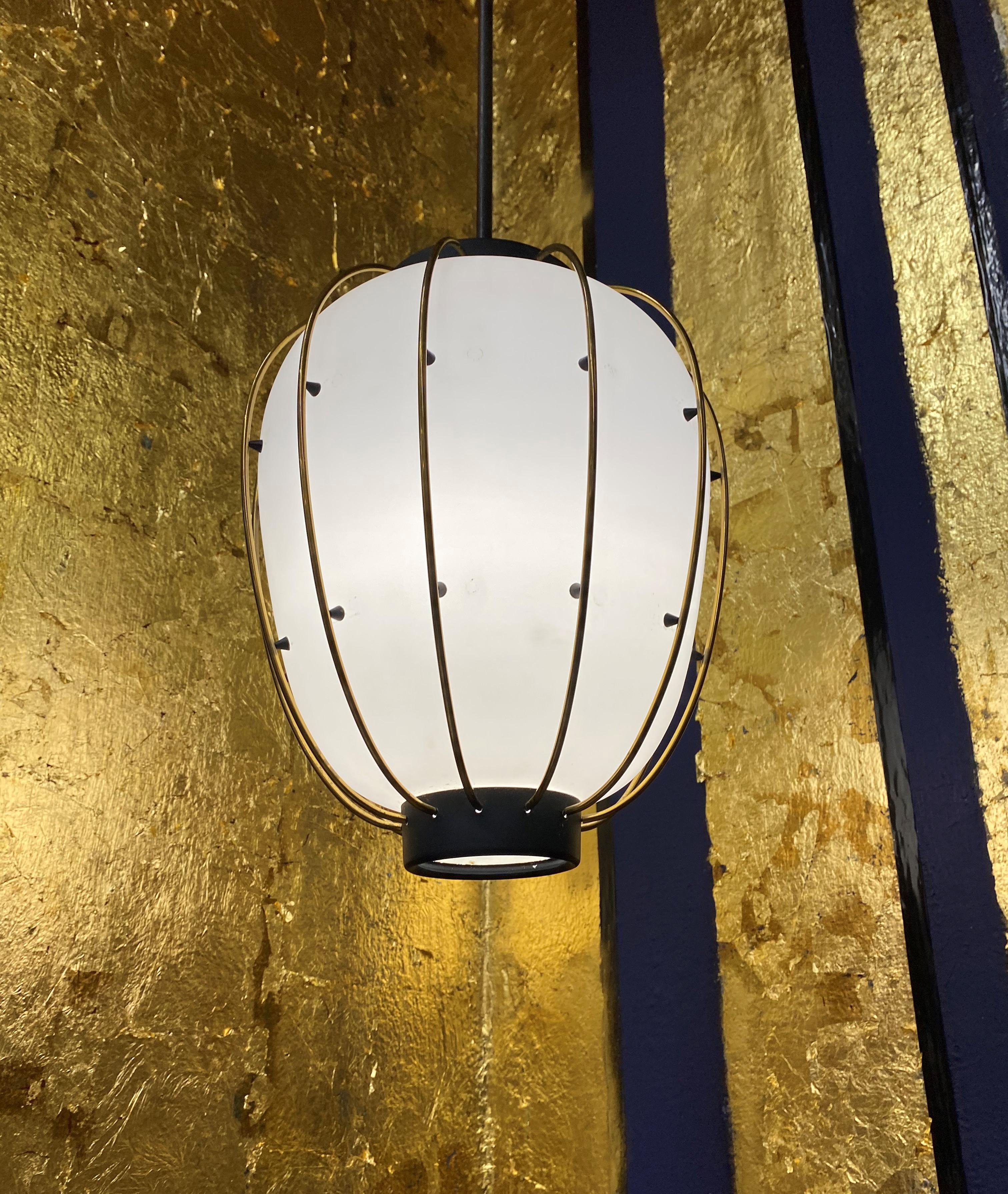 Beautiful pendant lights / Lanterns in lacquered metal, brass and opaline glass, attributed to Stilnovo and very much in the manner of Angelo Lelii's designs for Arredoluce from the same era.
We have 1 available immediately and 2 more that we have