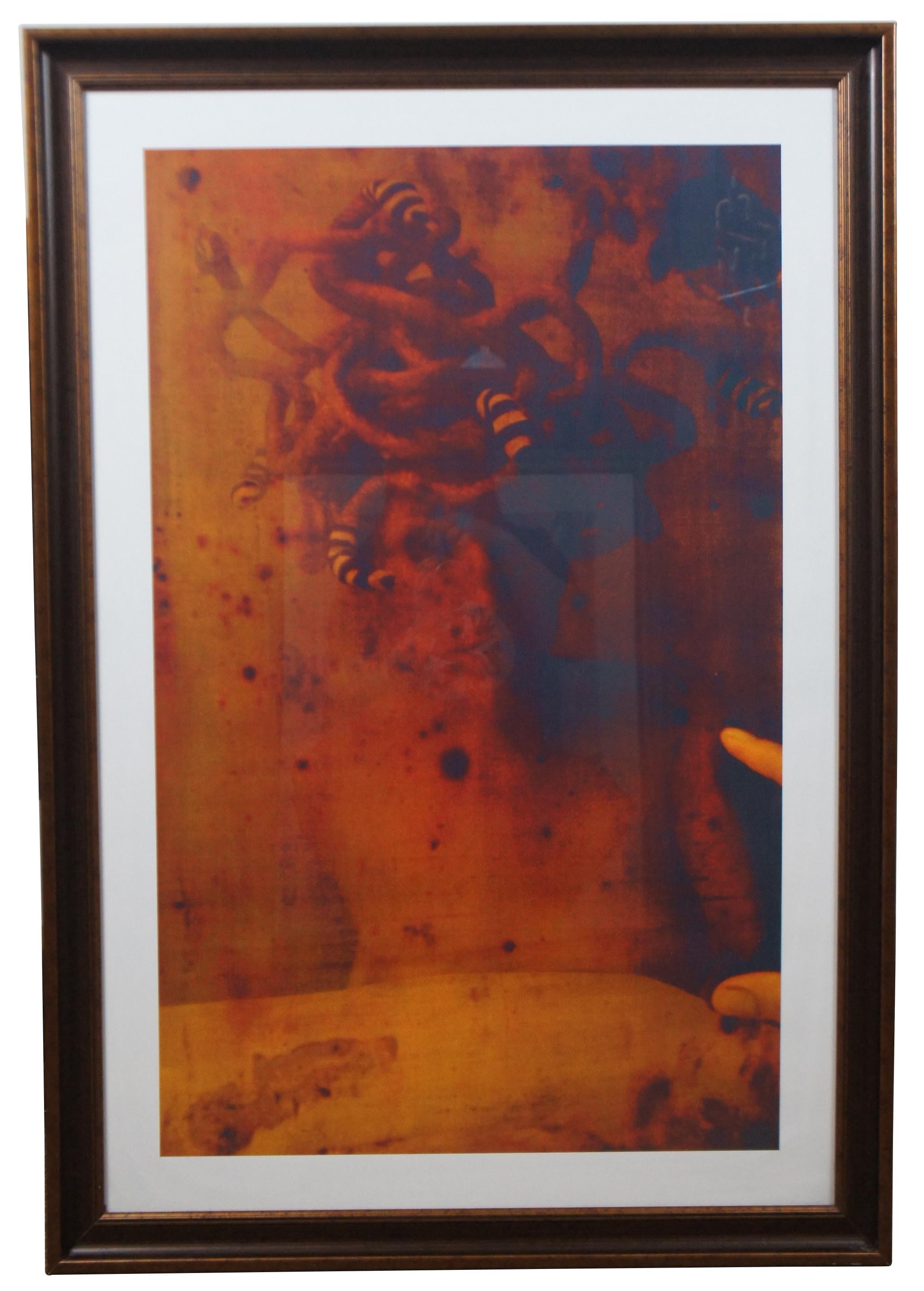 Set of three modern surrealist double exposure prints in shade of orange and red, showing a female figure with Medusa-like serpentine hair accented with peculiar ring-tailed segments.

Measures: 27” x 1.25” x 38.75” / Sans Frame - 23.5” x 35.5”