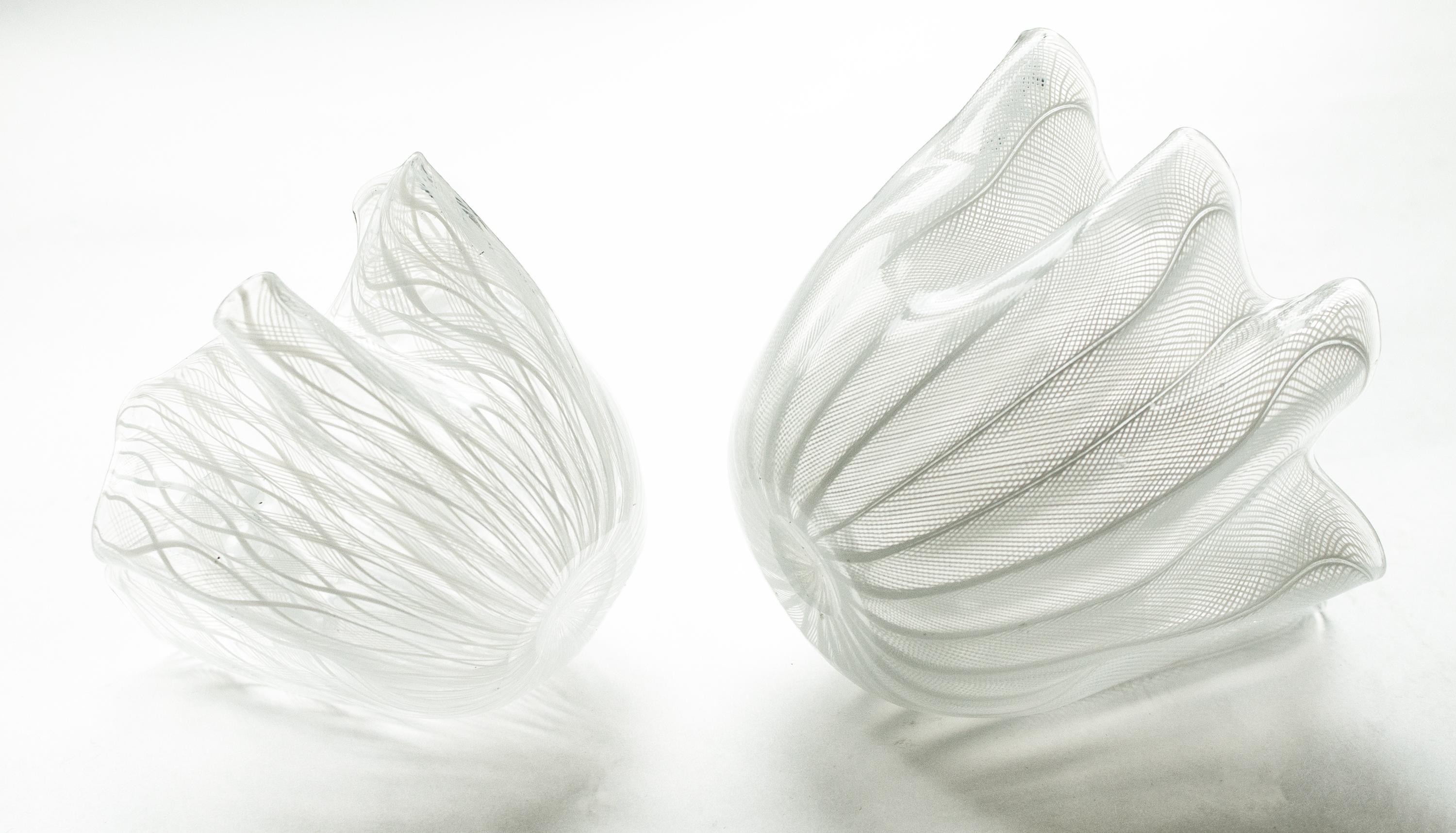 Three Murano Handkerchief Vases/Bowls crafted in Murano, Italy, known for its exceptional glass artistry, are now available. These hand-blown pieces showcase a captivating design featuring delicate white Zanfirico ribbons adorned with pink and white