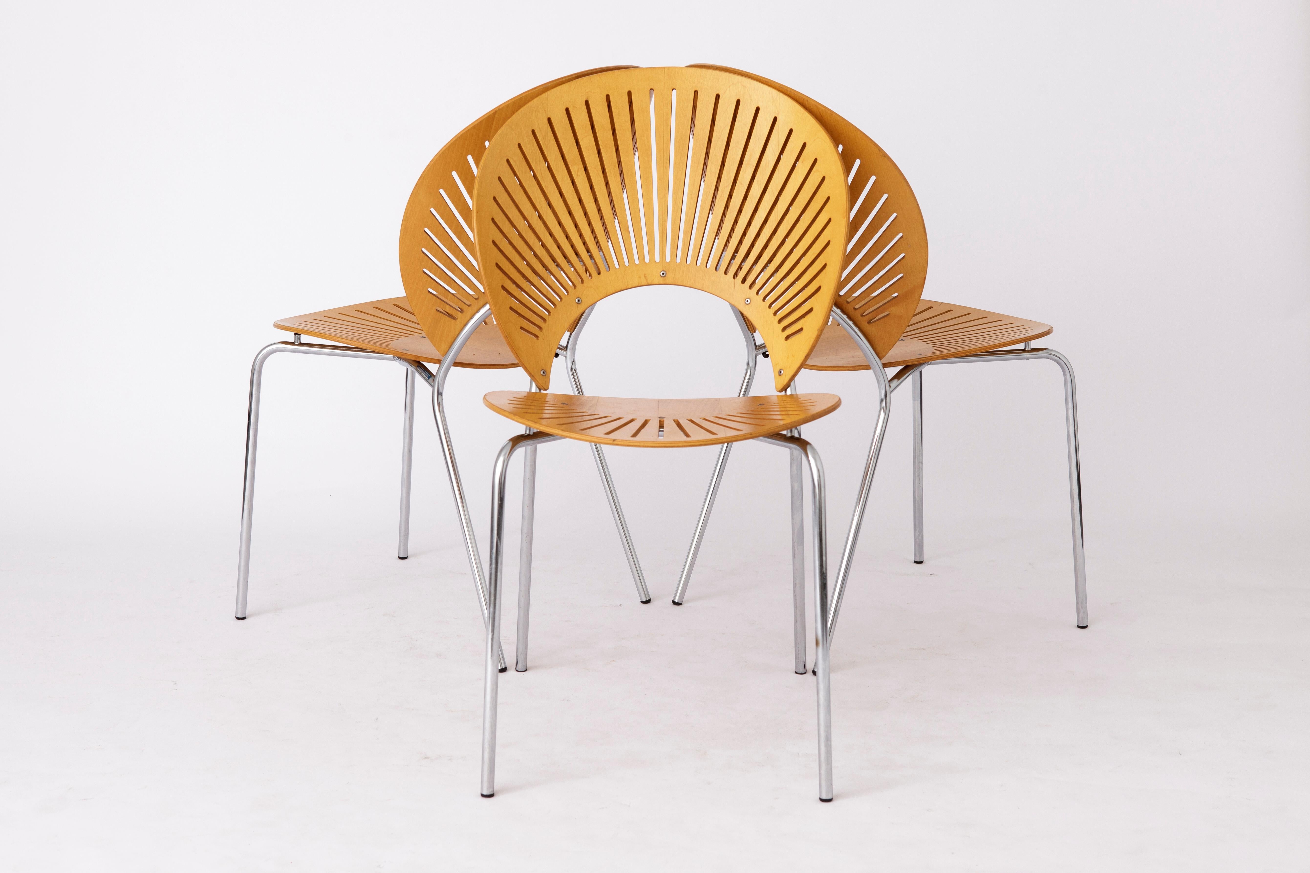 3 elegant dining chairs by Danish designer Nanna Ditzel in version beech wood. 
Model: Trinidad from 1993. 
Manufacturer: Fredericia, Denmark. 
Displayed price is for 3 chairs. 

The chairs are in very good condition. 
Metal frame and beech plywood