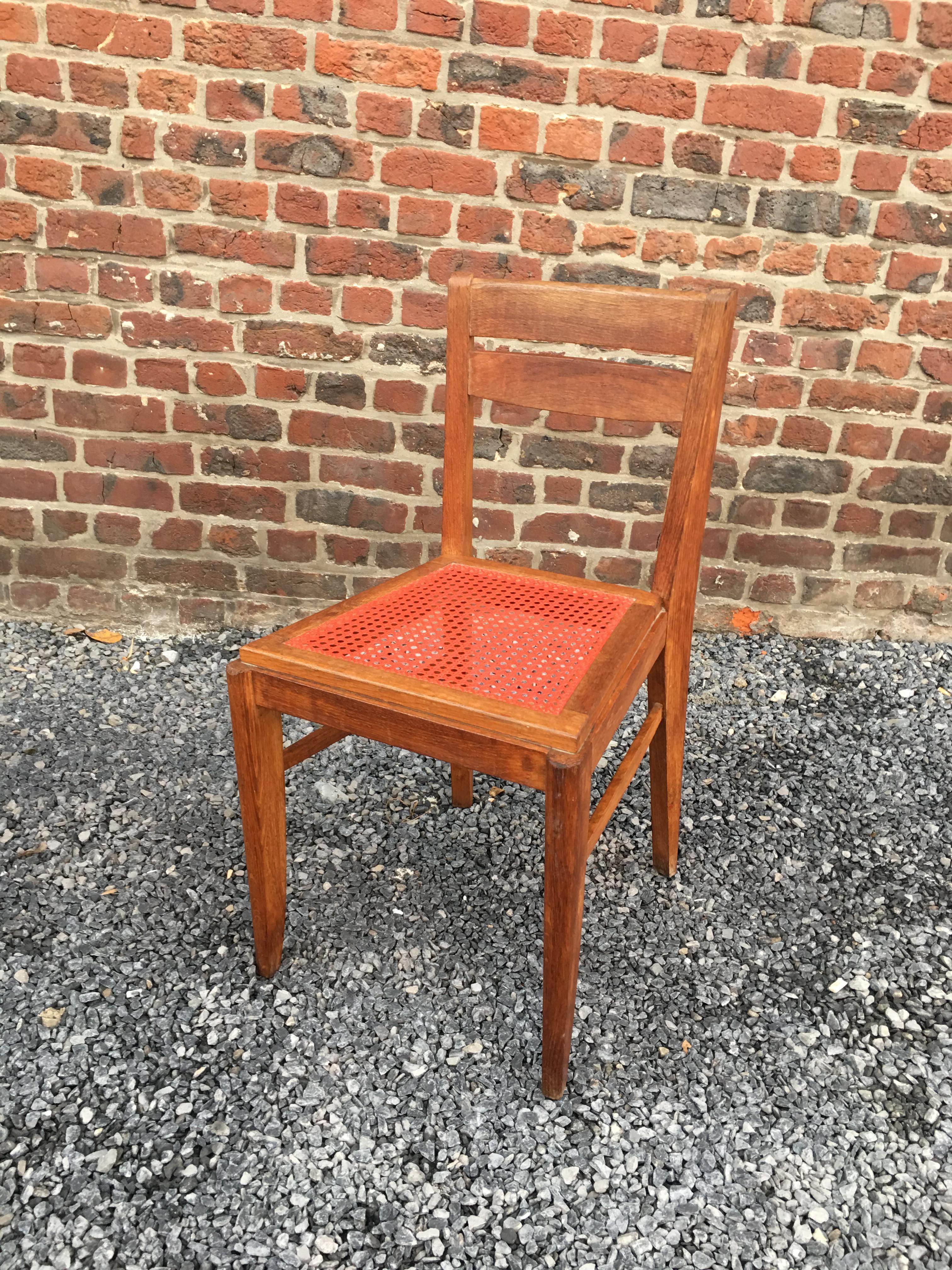 3 oak chairs in the style of René Gabriel, circa 1950.
Colorful caning of origin.