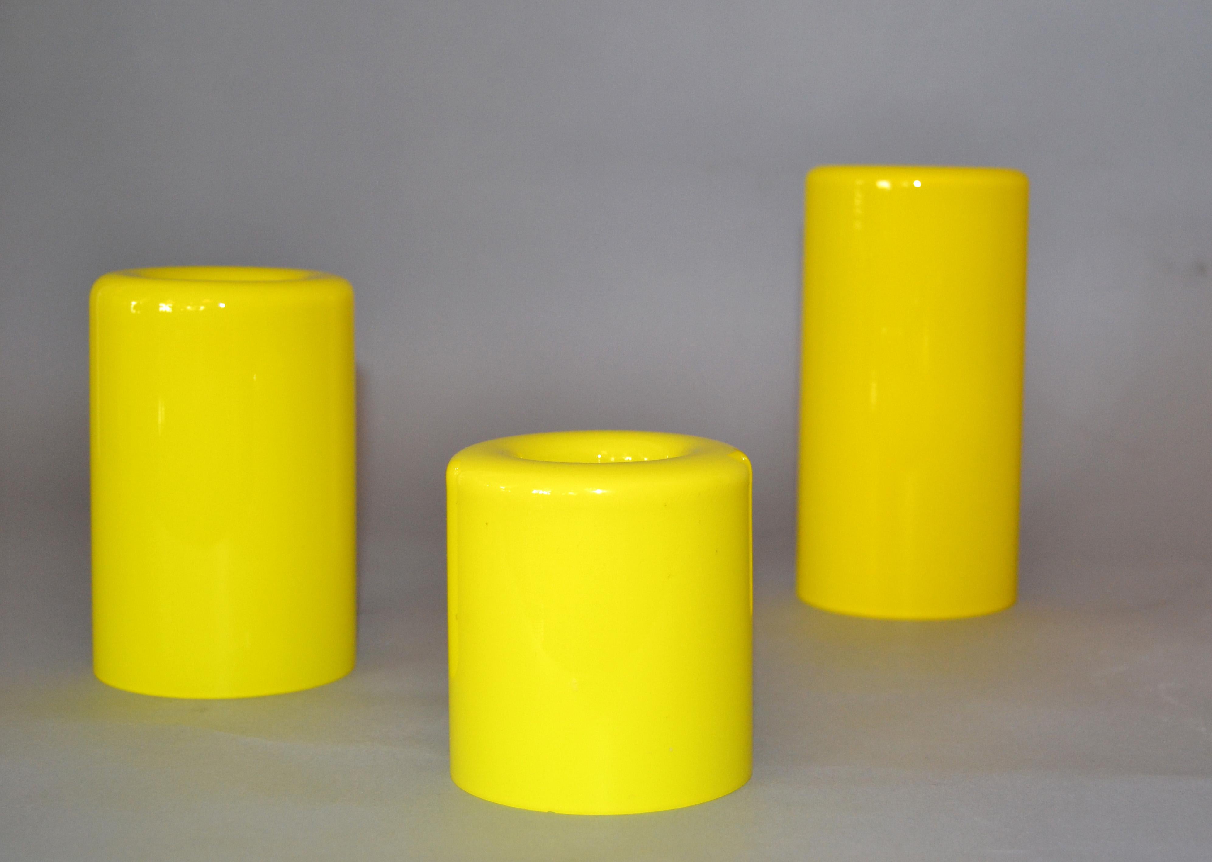 Set of 3 Orrefors yellow glass 'Eternell' candlestick holders, designed by Owe Elvén.
All 3 have the original foil label.
The tallest candleholder measures 6 1/4 inches in height, the medium candleholder measures 4 3/4 inches and the smallest