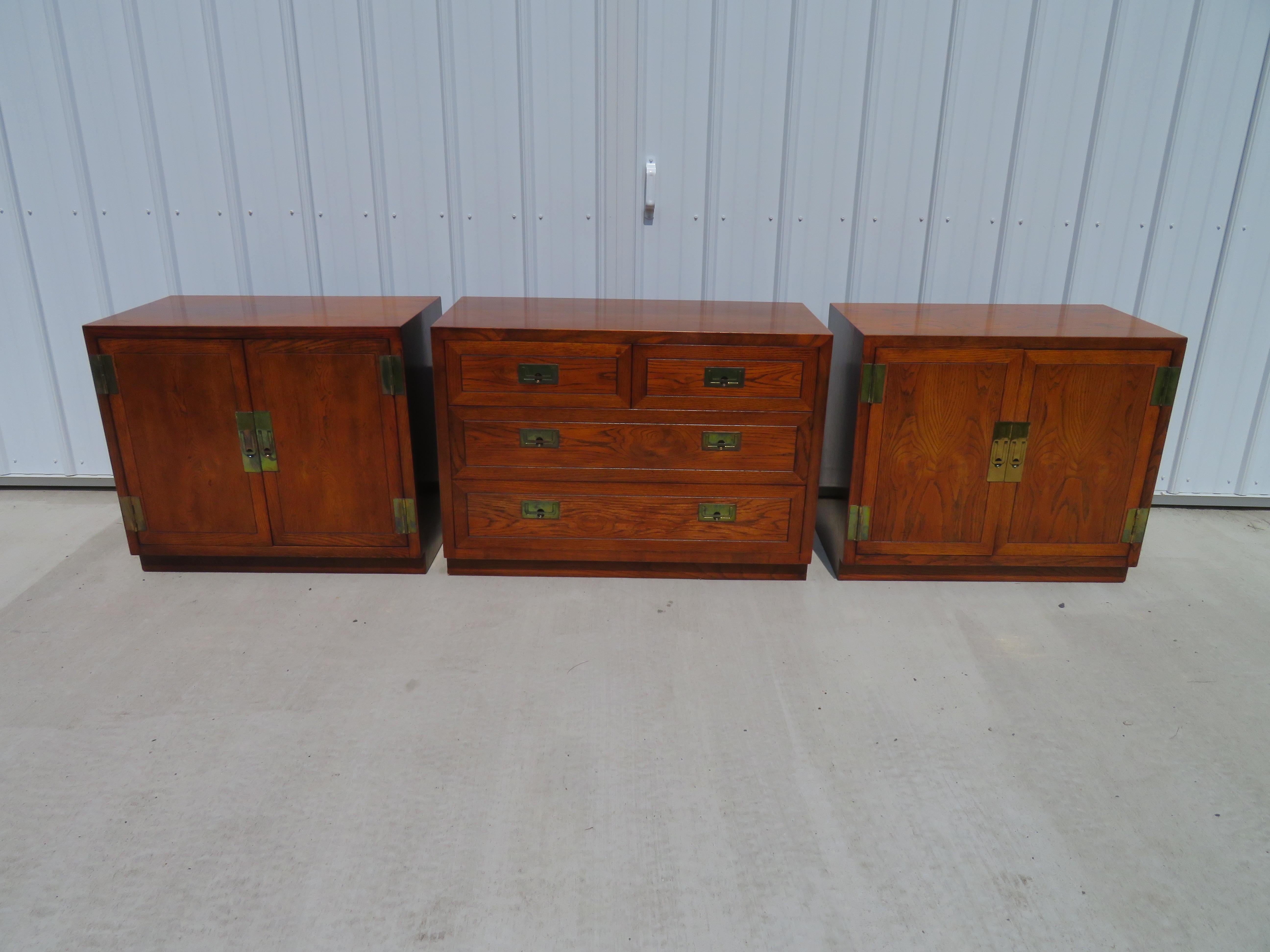 3 outstanding Henredon Campaign chests forming a long low credenza. I love all three used together as shown but can also be used as bedside bachelor chests or even as end tables. The two-door chests measure 28