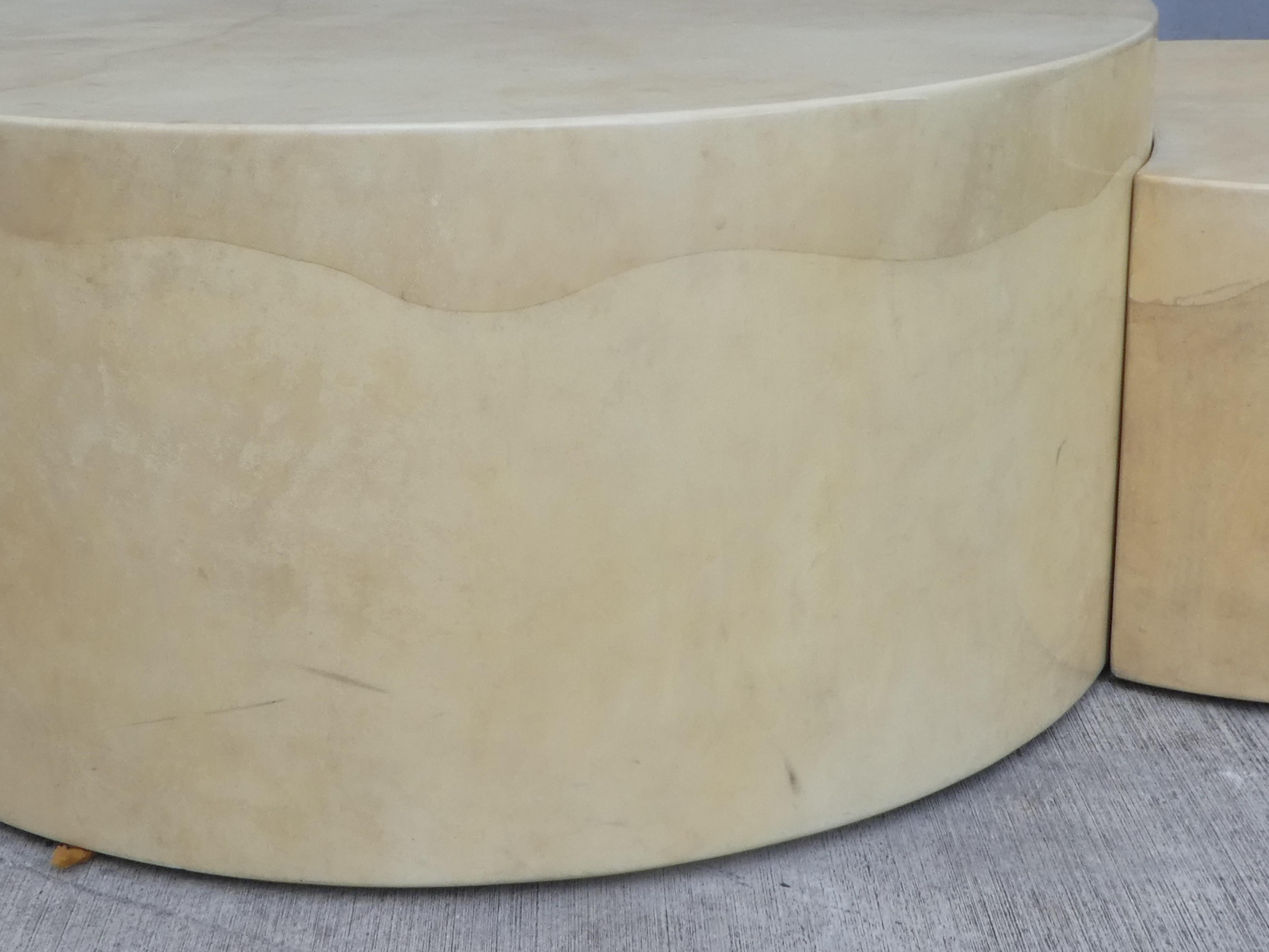 Unusual 3-part lacquered goatskin coffee table with two pull out seats. The two side pieces separate completely to provide seats or two separate tables.