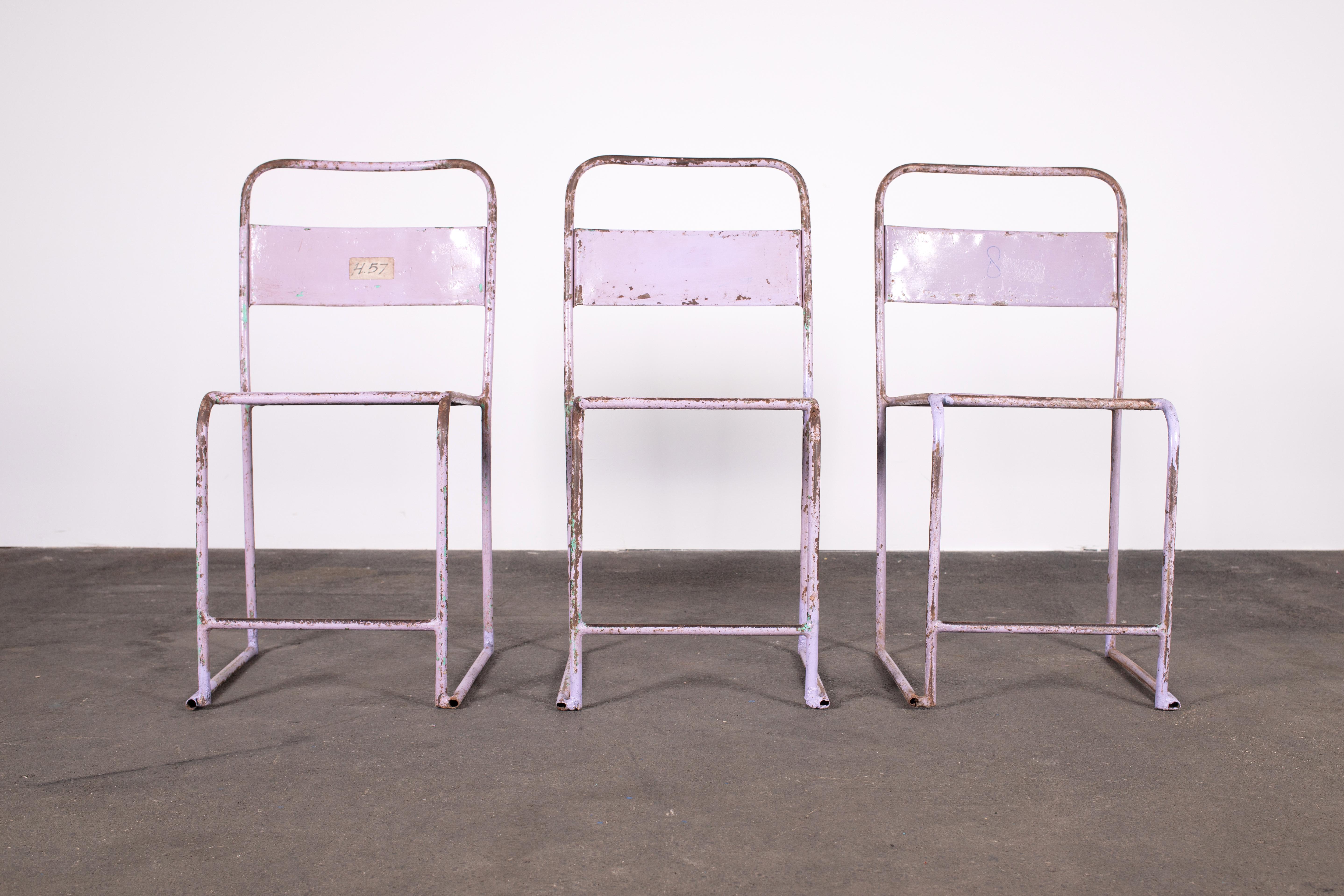 3 structurally sound and heavily patinated Mid-Century Modern Industrial Chic Tubular Steel Stacking Chairs in lilac and rust. Sourced in Germany, these chairs, likely of the 1930s, show construction techniques and functional aesthetic of the
