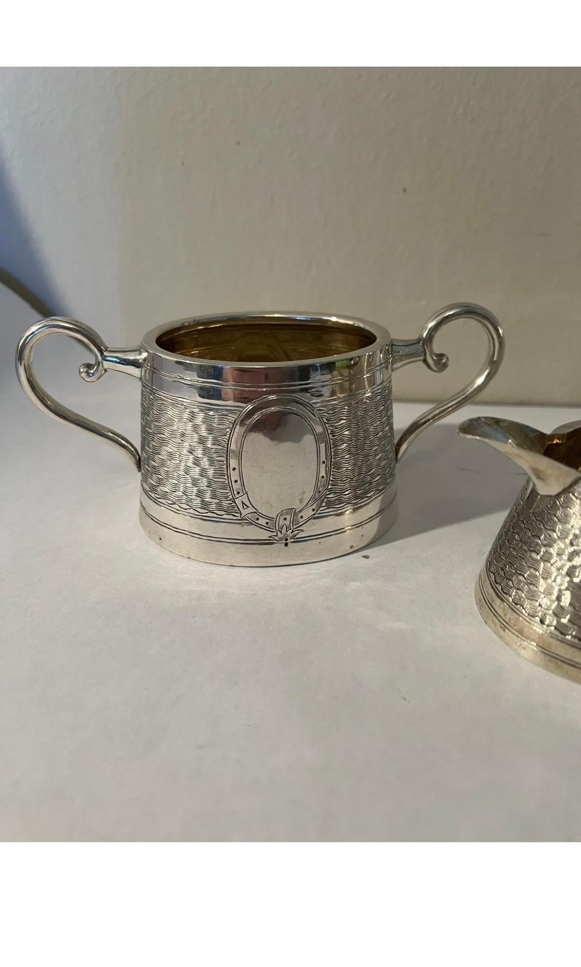 Wang Hing (Chinese, 1854-1941), circa early 20th century. A 3 piece set of Chinese export silver tea service by renounced maker Wang Hing. The set is comprised of a teapot, sugar bowl and creamer. 
<br> Marked to underside 