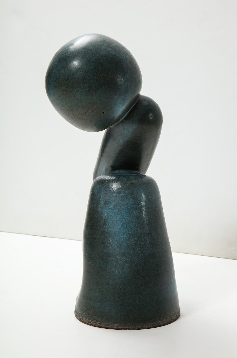 Wheel-thrown hand molded elements cantilevered over cone base. Dark teal glazes. Artist-signed to underside.