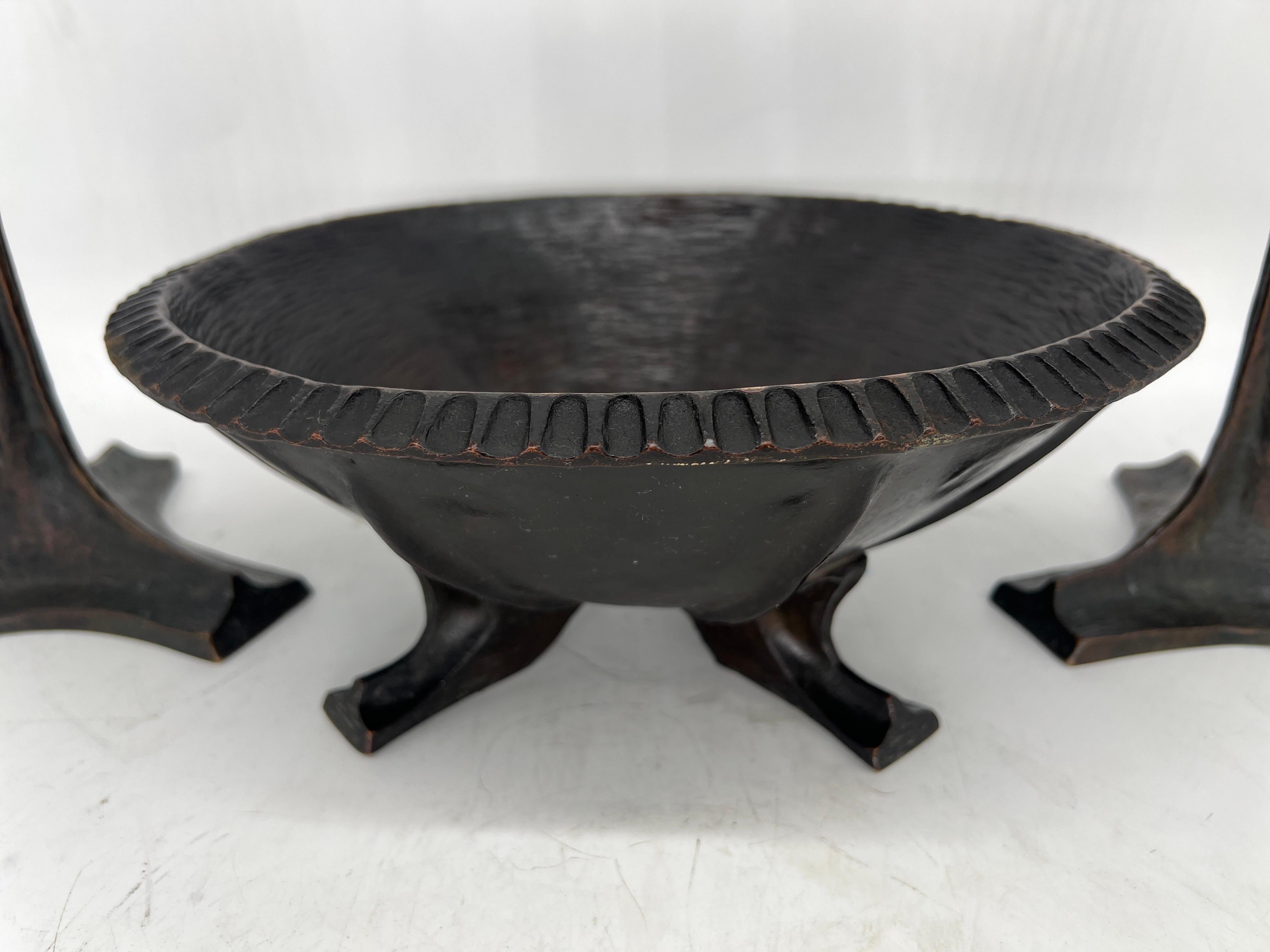 American, late 19th to early 20th century.

The set consists of a large bronze centerpiece bowl which has been hand forged with a reeded recessed edge, water sculpted interior, paneled bottom and resting on four finely detailed feet. Note: This bowl