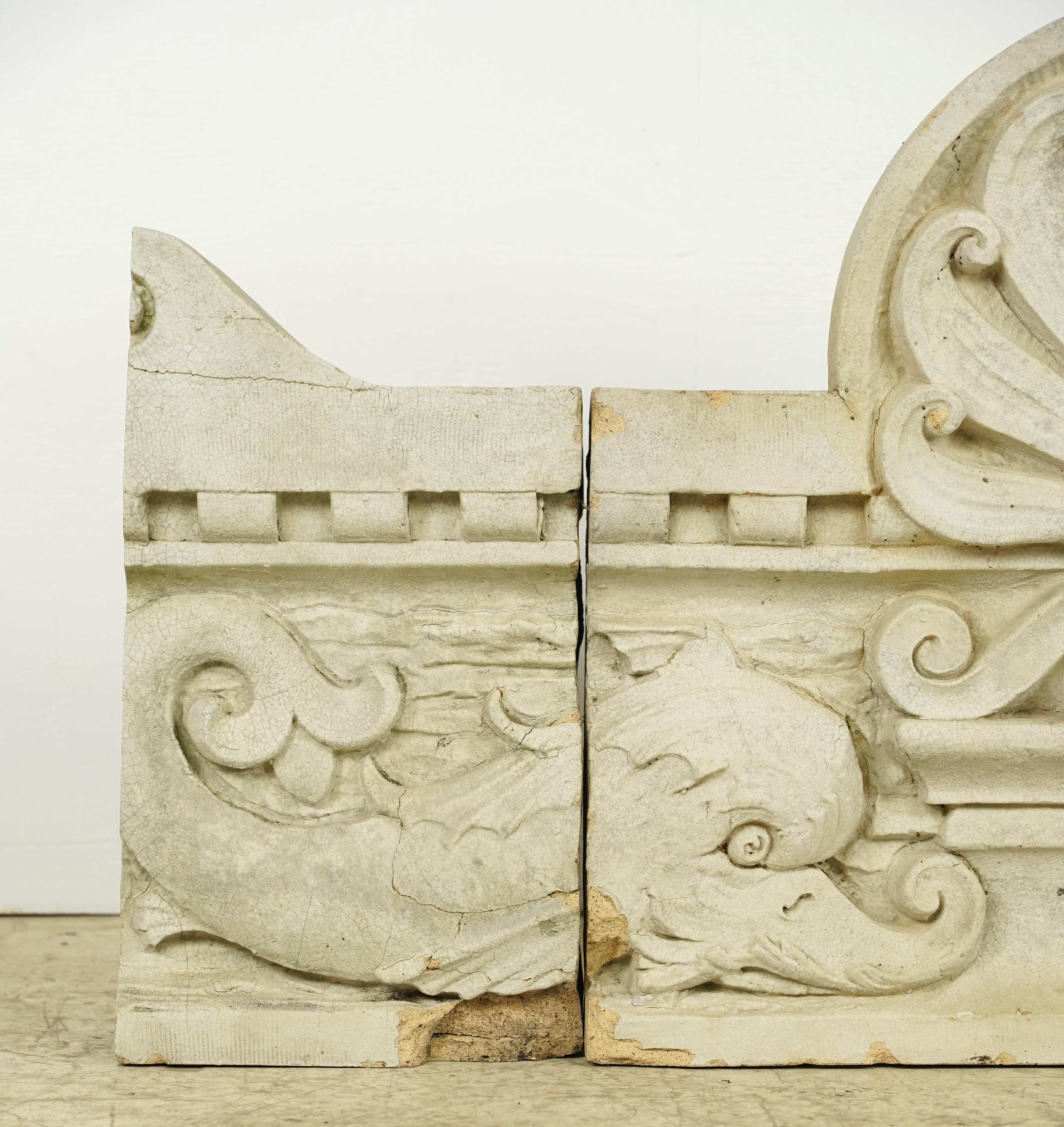 This three piece high relief stone frieze showcases intricate craftsmanship and carved marine life details of two dolphins and a large centered shell. Recovered from the Ellis Auditorium in Memphis, TN. Elvis Presley graduated in the building and