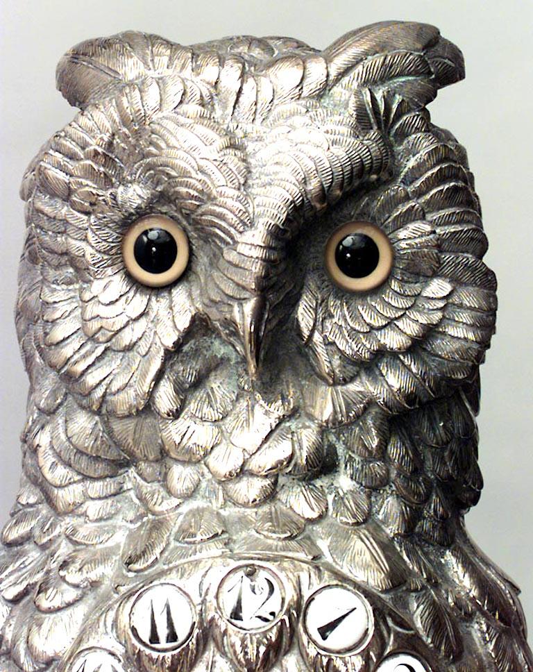 3-Piece English Victorian silver plated owl design clock and pair of candelabra with oak leaf trim. (PRICED AS SET).
 