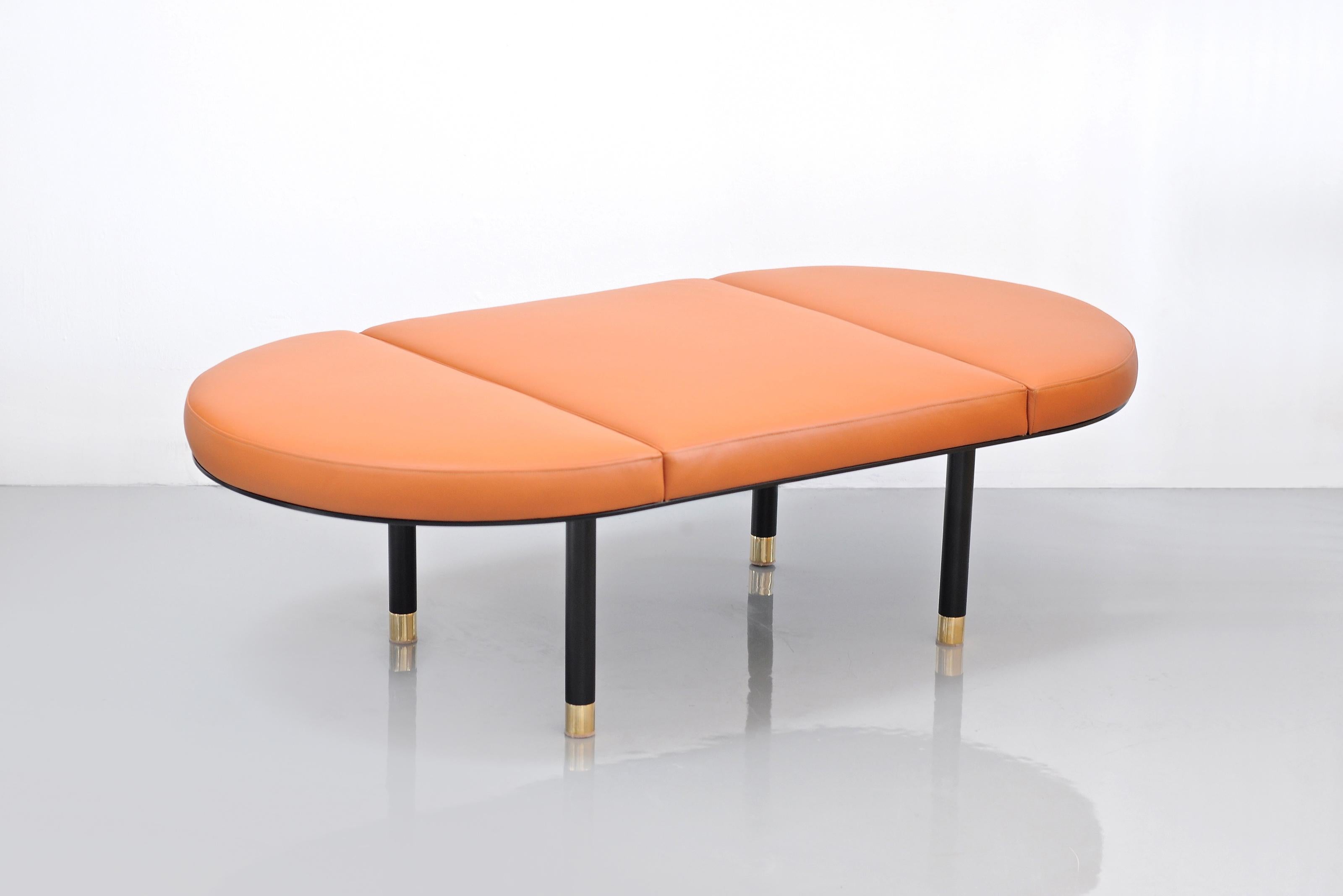 3 Piece Pill Leather Bench by Phase Design
Dimensions: D 149.9 x W 71.1 x H 38.1 cm. 
Materials: Powder-coated steel, brass and leather.

Powder coated steel base with solid brass tips. Powder coat finishes available in flat black, flat white, or